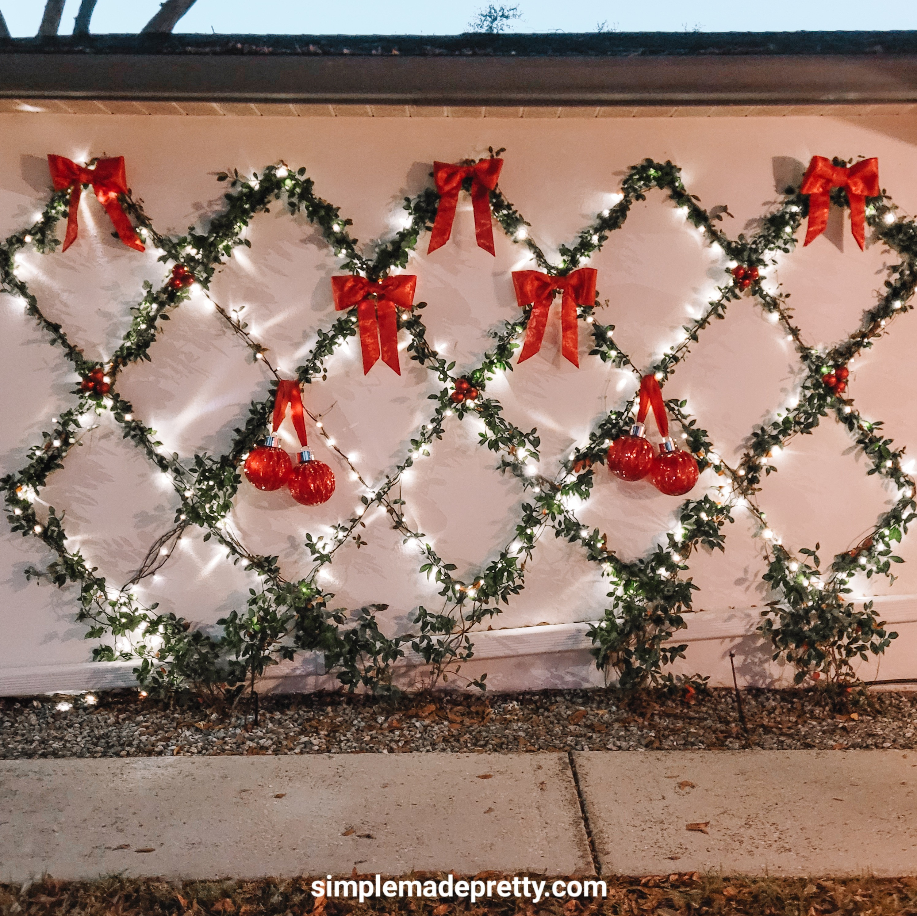 Our little outdoor Christmas corner 🌿🎄 Red bows, twinkle lights, and the jasmine trellis that looks magical at night. Linked all the outdoor pieces!

#OutdoorChristmasDecor #ChristmasPorch #HolidayDecorIdeas #LTKHome #FestiveFrontPorch 

 #LTKHoliday #LTKSeasonal #LTKHome