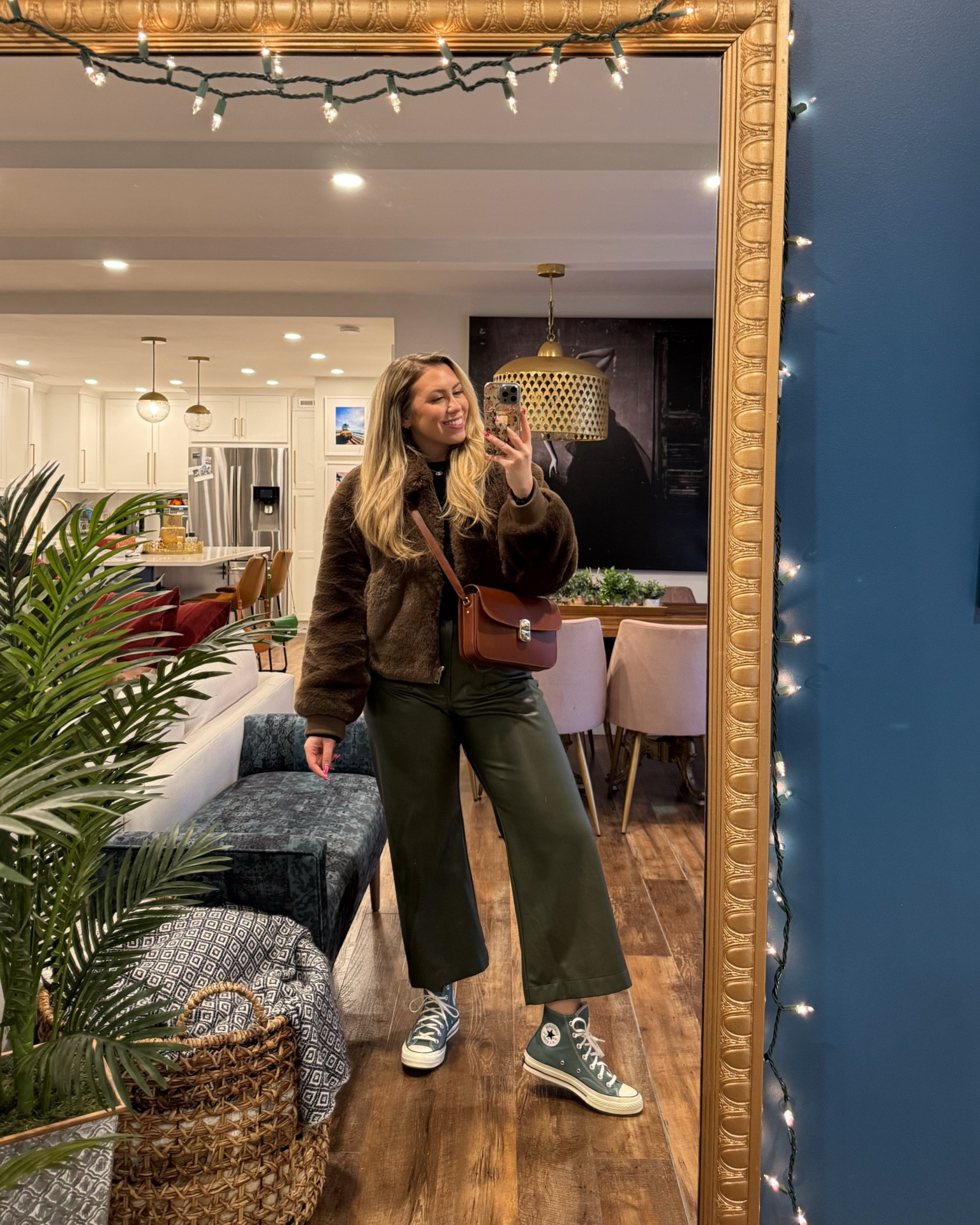 Cute winter outfit with faux fur short chocolate coat, faux leather Colette cropped wide leg pants, sezane bag and high top converse. Winter outfits, holiday outfits 

#LTKMidsize #LTKSeasonal #LTKHoliday