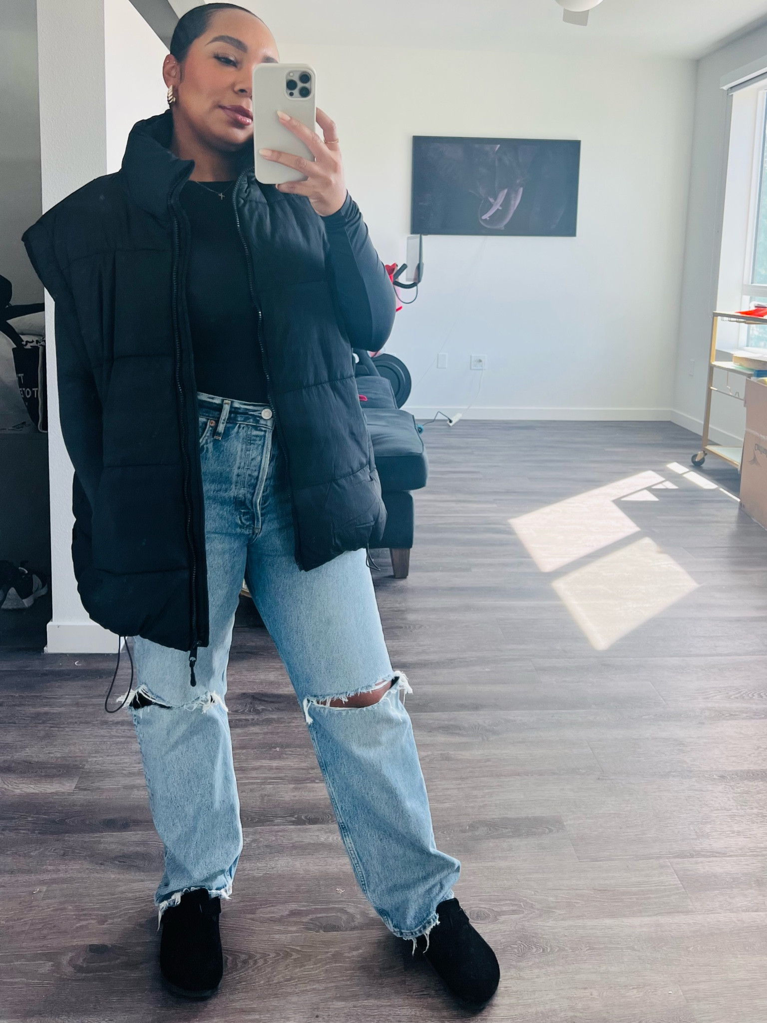 Black oversized puffer vest agolde jeans skims bodysuit black Birkenstock clogs 

#LTKfit #LTKshoecrush #LTKstyletip