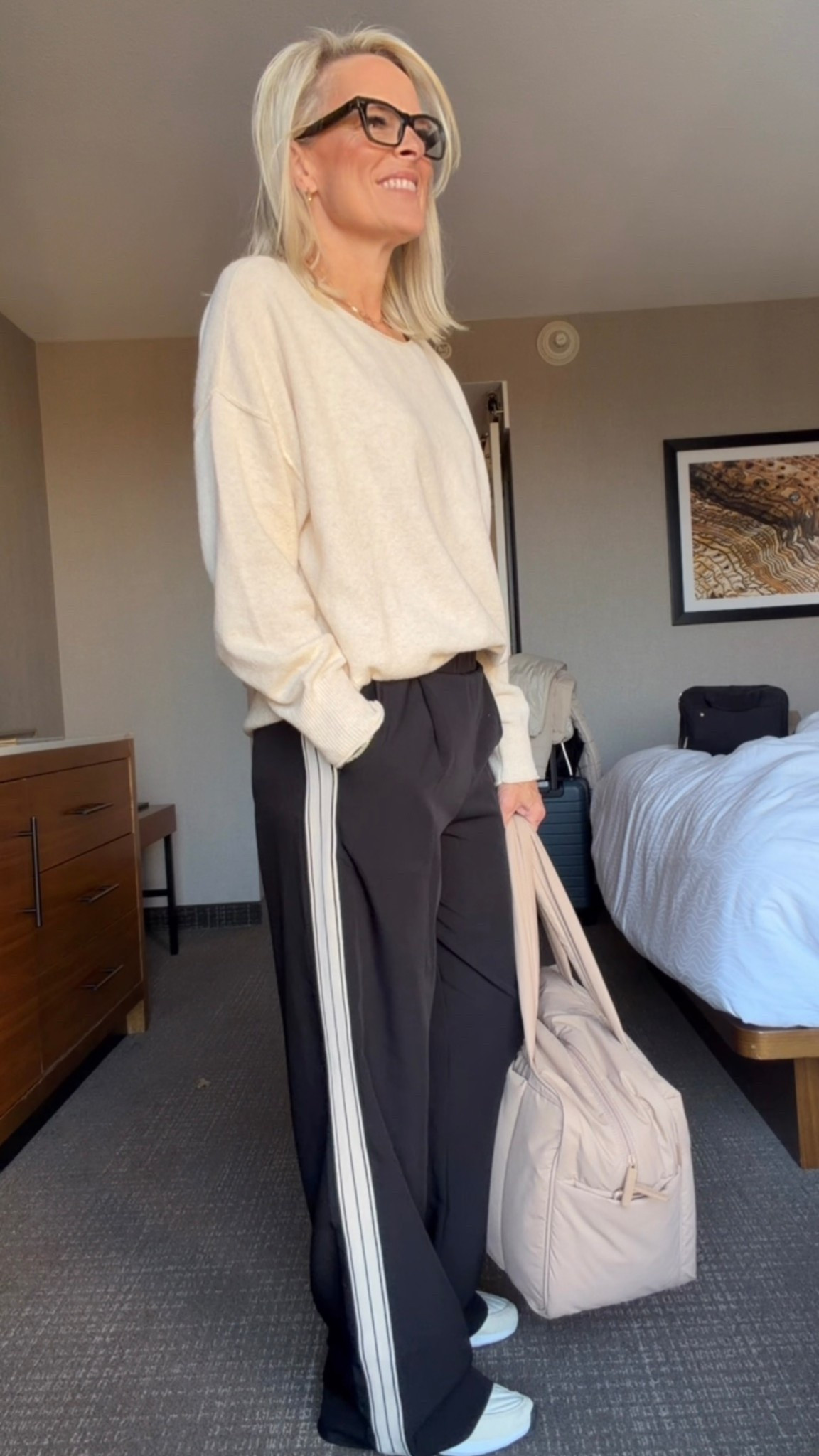 Travel outfit 
I get comments or questions about these track pants every time I wear them 
Very comfy, pockets 
Fit is tts wearing small 

My fave carryon is back at 20% off 
Guaranteed delivery by 12/24 if ordered by 12/15, 12:30 PM PT 

I’ll link theis sweater but a couple others also bc it’s almost sold out 

The Spanx air essential crew is great with it!! 
Use code CSWANSONXSPANX for first customers for a discount 

Tennis shoes - LOVE these super comfy and on sale! 

#LTKGiftGuide #LTKTravel #LTKOver40