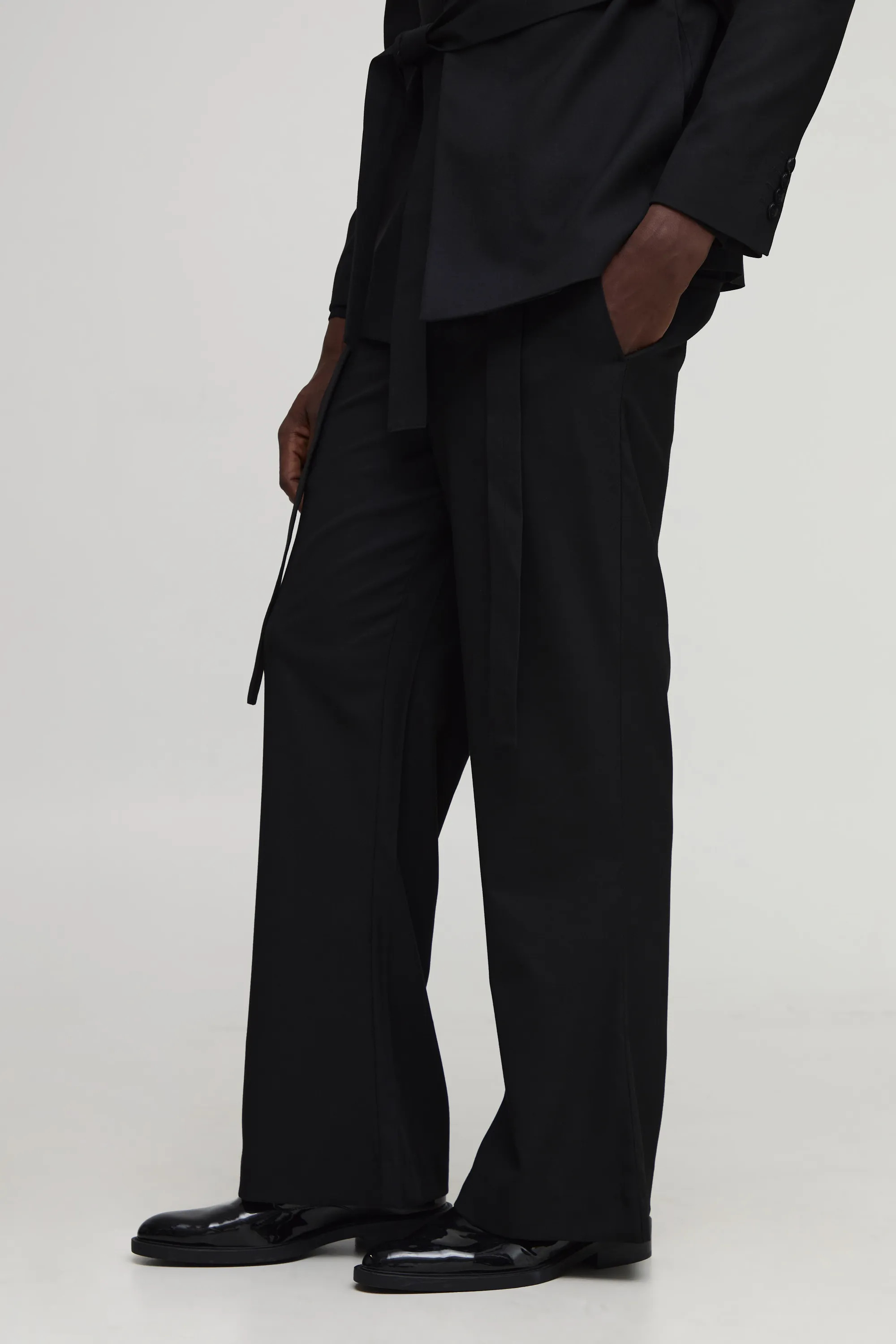 Flared Belted Suit Trousers | boohooMAN (US & Canada)