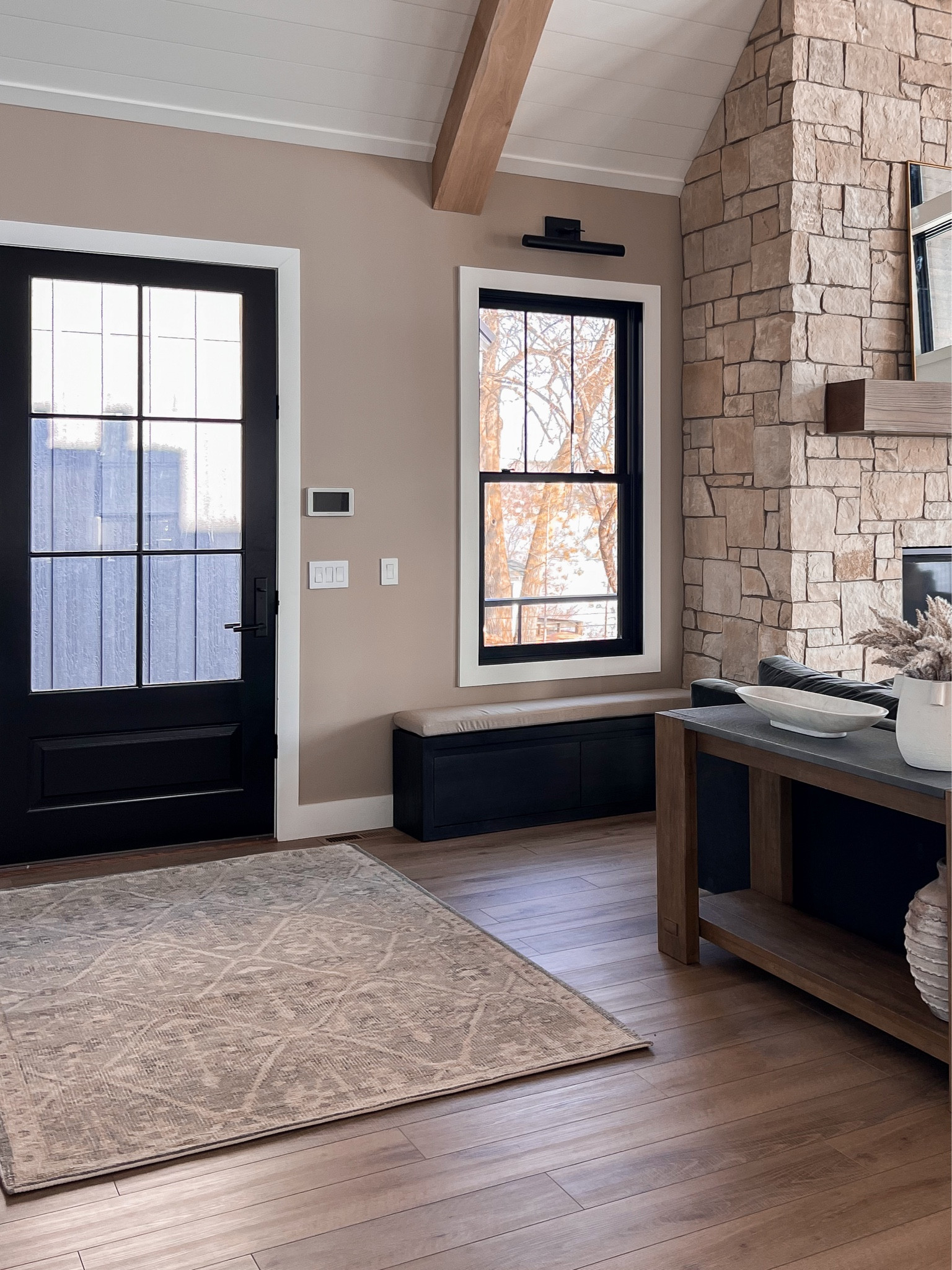 Cabin entryway with storage bench with shoe compartment below. I swapped out the black console table to one with wood tones and it feels so much cozier! 

#LTKstyletip #LTKhome