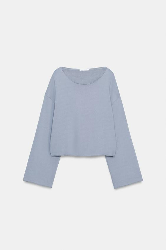 Sweatshirt made from a cotton blend yarn. Boat neck and long sleeves with a flared hem. Straight ... | Zara US