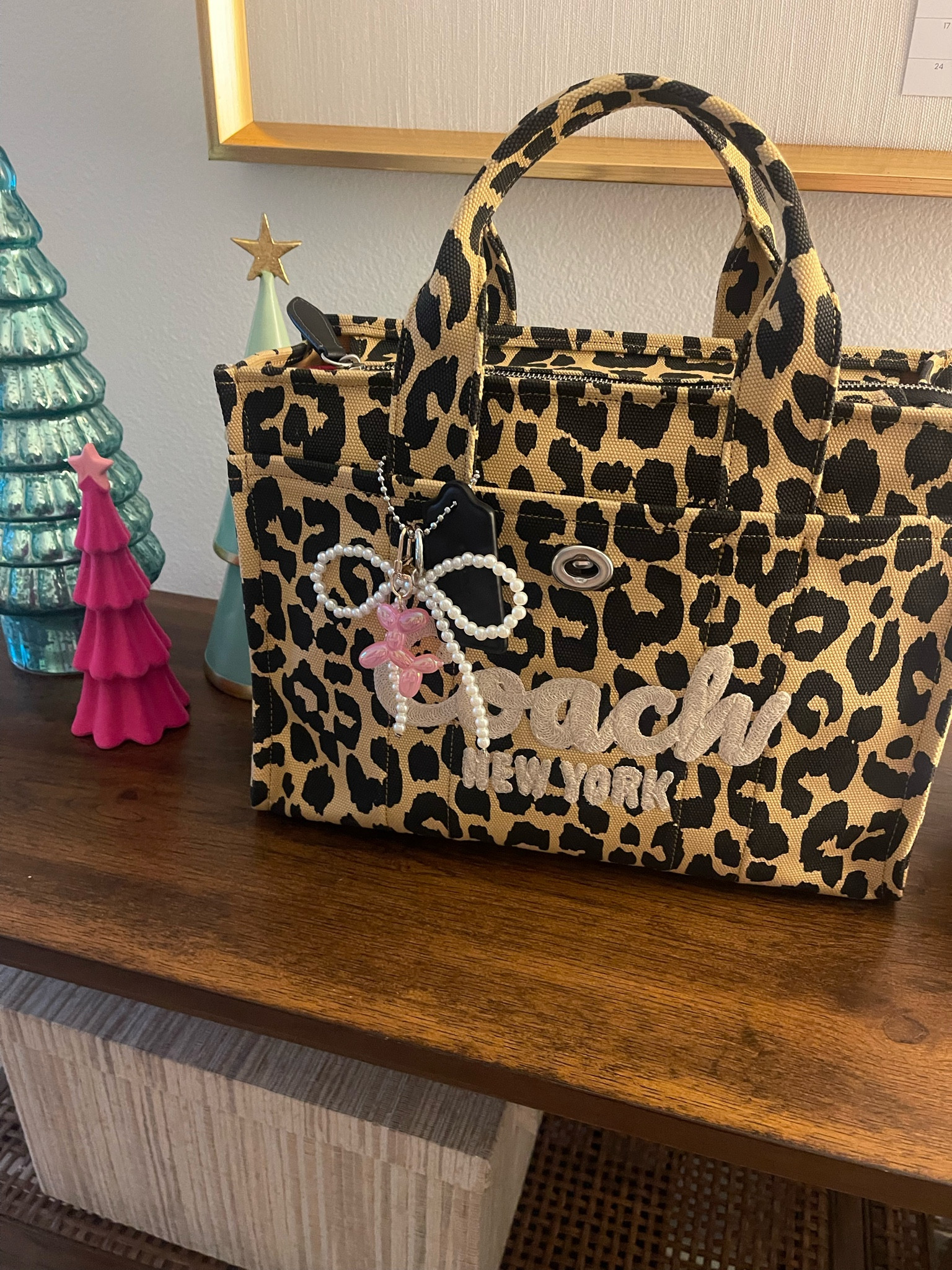Cheetah print tote work bag! Key chain bag accessories! Pink balloon animal, pearl bow ribbon key chain! 

#LTKSeasonal #LTKHoliday