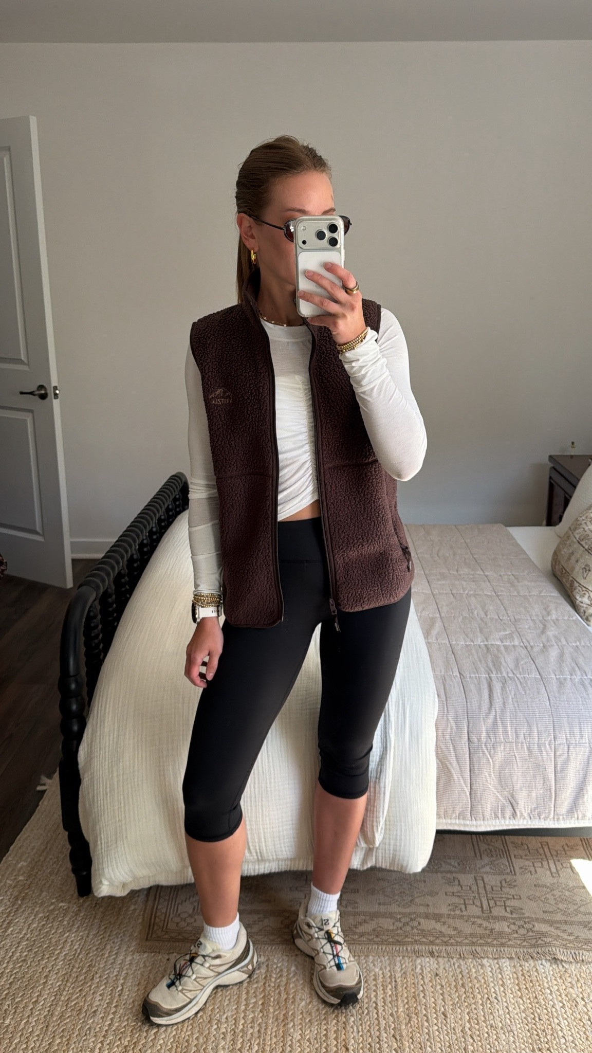 10/5/26 Early Fall Walking Outfit 🍂

My current uniform for an afternoon walk on those early fall transition days 🍂🤎 Capri leggings + socks from Amazon, @FreePeople Movement long sleeve, sneakers + my chocolate brown @Aritzia sherpa vest layered on top.
Finished with Amazon sunglasses — sporty, cozy + perfect for when it’s not quite cold yet. Linking everything I can here!