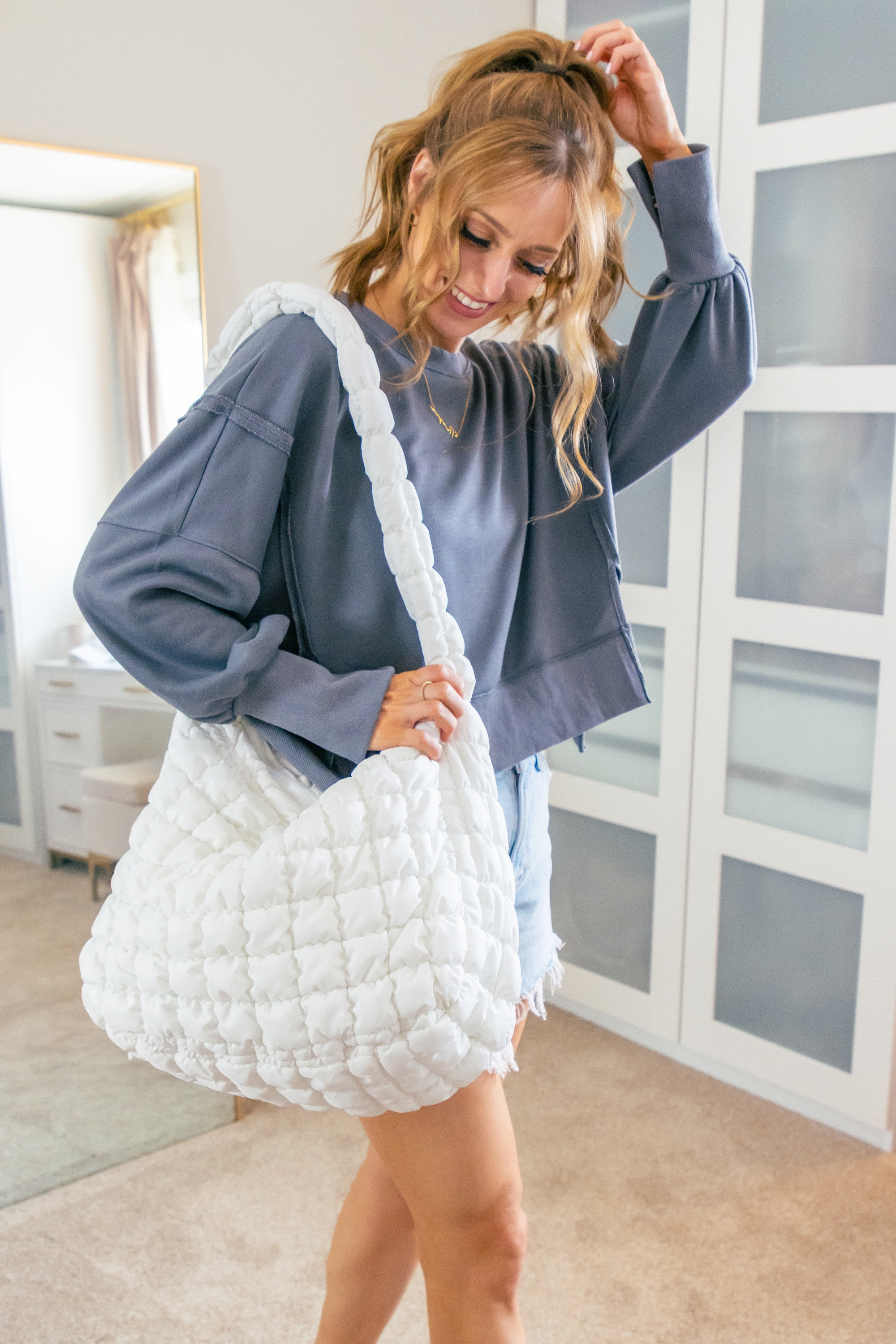 I'm loving this cozy sweatshirt paired with a puffy tote bag. It's a great Free People look for less. Perfect for a casual day! I'm in a size medium in the dark gray color.
 

 #LTKootd #LTKOver40 #LTKSaleAlert