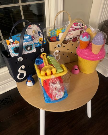Kids’ beach bag gift idea 💡 These bitty bogg bags are adorable 🥰 Personalized with some initial jibbitz and they each got sunnies! 

Toddler gift ideas. Toddler gifts. Kids presents. Amazon finds. Kidkraft table. Toddler toys. 

#LTKxTarget #LTKfamily #LTKtravel