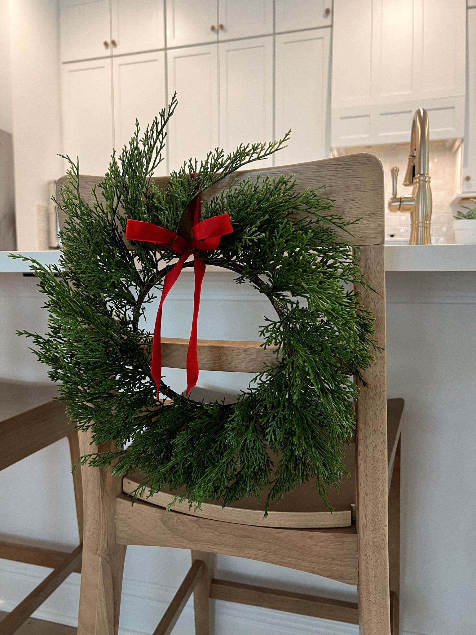 Wreaths on our kitchen counter stools 🎄❤️  #amazonfinds #targetfinds #miniwreath #velvetbow #hearthandhand

#LTKHome #LTKHoliday #LTKFindsUnder50