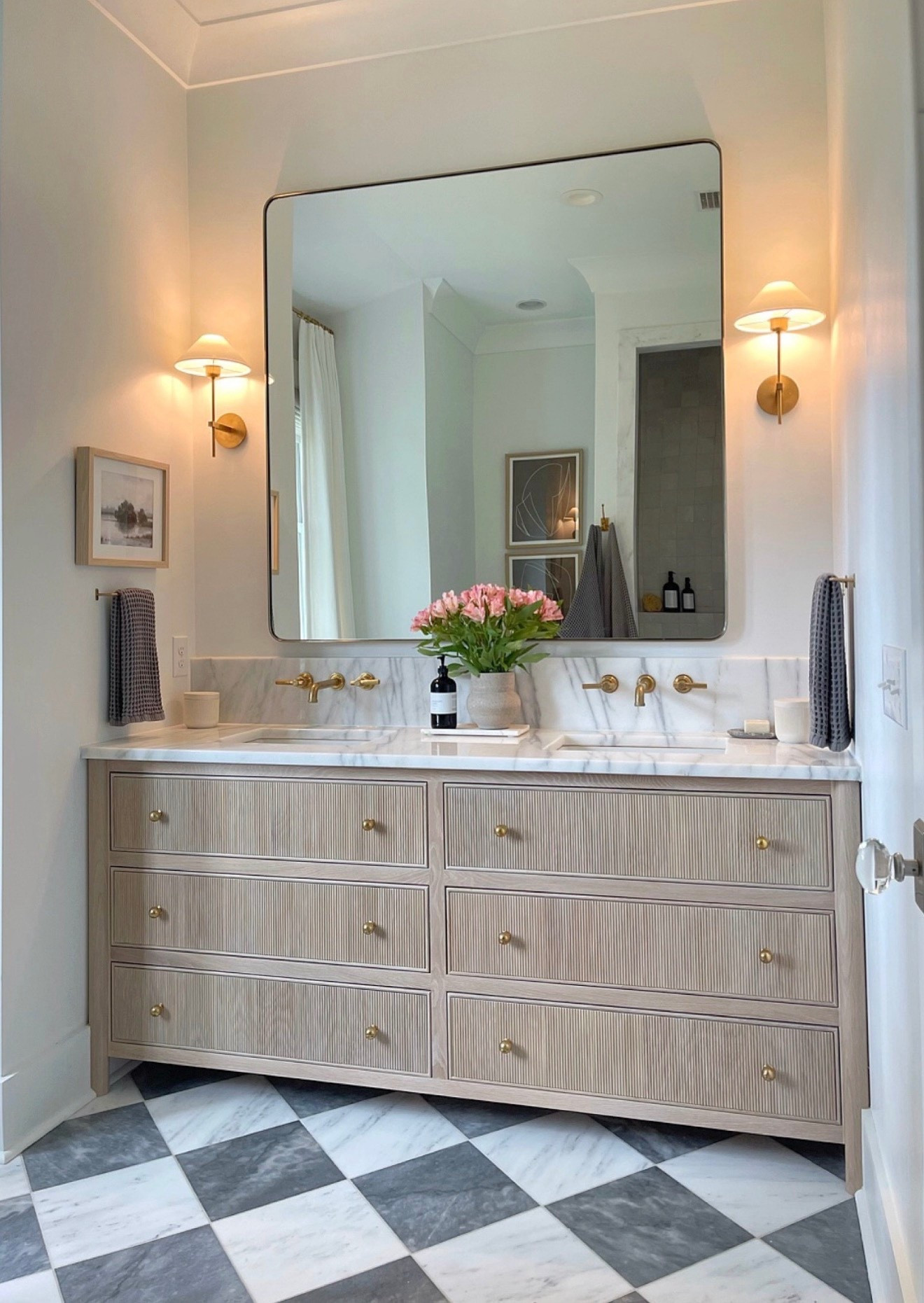 Miss our primary bathroom at the cottage so much🙏🏻. I will recreate something similar for our next home that’s currently in the works with some of the products linked here!

Master bath, marble floors, brass sconces, brass wall mounted faucet, Reese’s vanities, waffle hand towels, bath towels, bathroom decor, bathroom accessories, oversized brass mirror @Wayfair 

#LTKSaleAlert #LTKHome