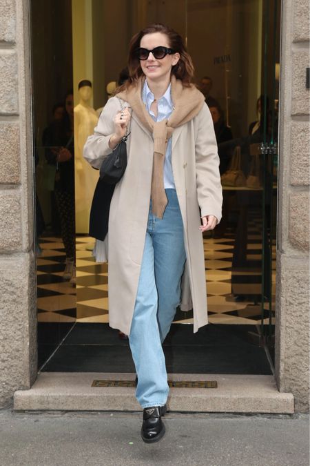 I think it's safe to say that at this point we're all ready for spring and thanks to the this preppy chic transition outfit worn by Emma Watson provides, we will be ready! 
Teaming up with @Saks, I'm replicating this layering-heavy look for the transition from winter to spring. It radiates a preppy vibe with a blue and white striped button-down, light wash blue jeans, black lug sole loafers, and a casually draped cashmere sweater tied around the neck. #Saks #SaksPartner 

#LTKstyletip #LTKworkwear