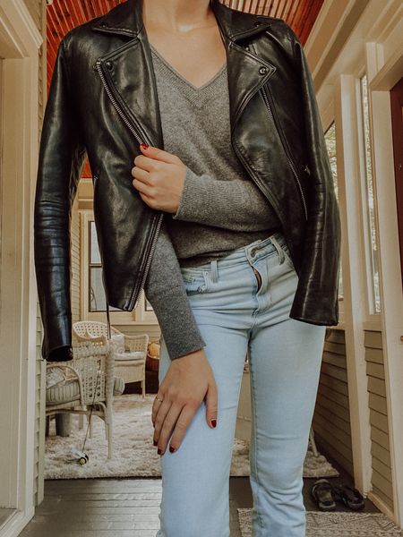 Casual autumn outfit, Cashmere sweater, v-neck sweater, light wash denim, flared jeans, Levi’s jeans, 725 jeans, leather jacket, all saints leather jacket, black leather jacket, Dalby jacket, suede boots, mejuri ring, gold ring, monochrome minimalist 

#LTKSeasonal #LTKstyletip