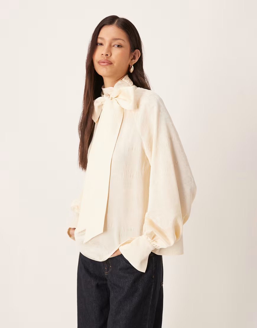 Pretty Lavish oversized pussybow bell sleeve blouse in cream-White | ASOS (Global)