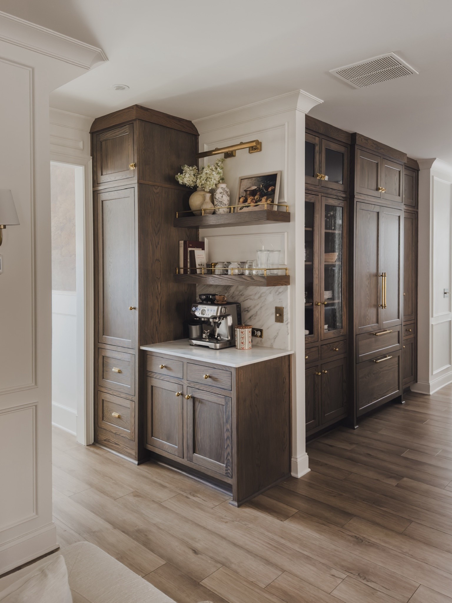 Coffee bar views in my home! Open concept shelving with unlacquered brass gallery rails create an aesthetic yet functional way to store items and display some of my favorite home decor finds. 

Home finds, neutral home inspo, coffee bar views, brass gallery rails, floating shelves, rich wood tones, unlacquered brass, coffee bar, picture light, brass hardware, open concept, decor book, faux florals, Breville, coffee essentials, coffee cup, digital art, Rejuvenation, Etsy, found it on Amazon, Wayfair, shop the look!

#LTKSeasonal #LTKHome