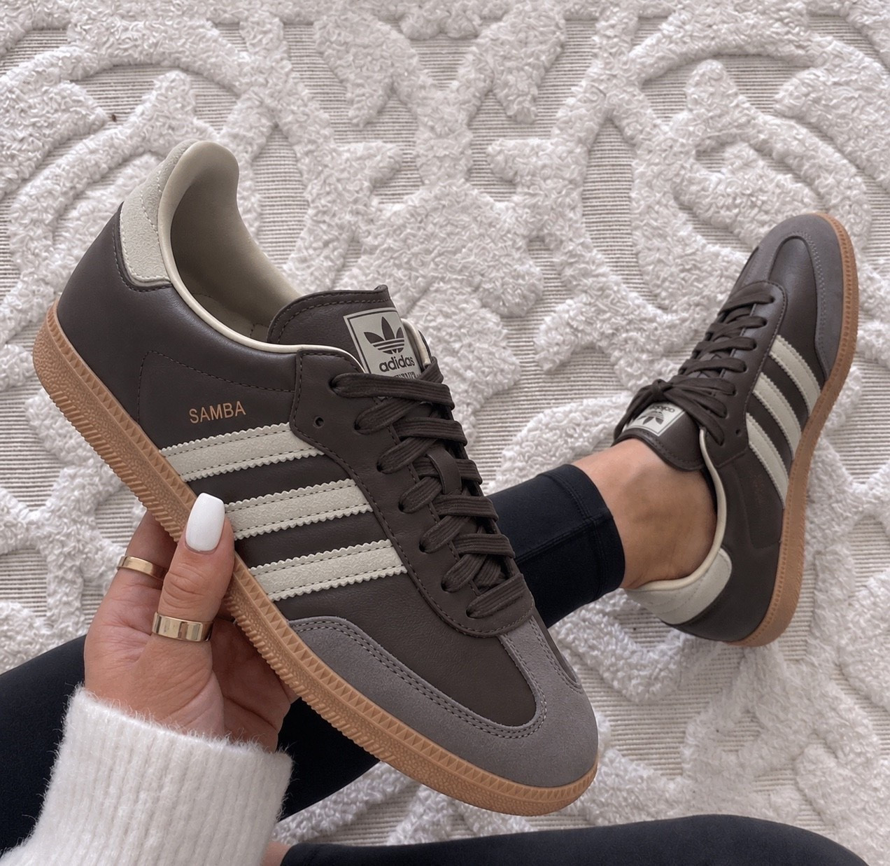 The adidas Samba OG Sneaker is a timeless classic with a sporty chic vibe that instantly elevates any outfit, and this rich brown colorway is perfect for fall. 

They fit true to size, but if you’re between sizes or have wider feet, sizing up a half size can give you a more comfortable fit.