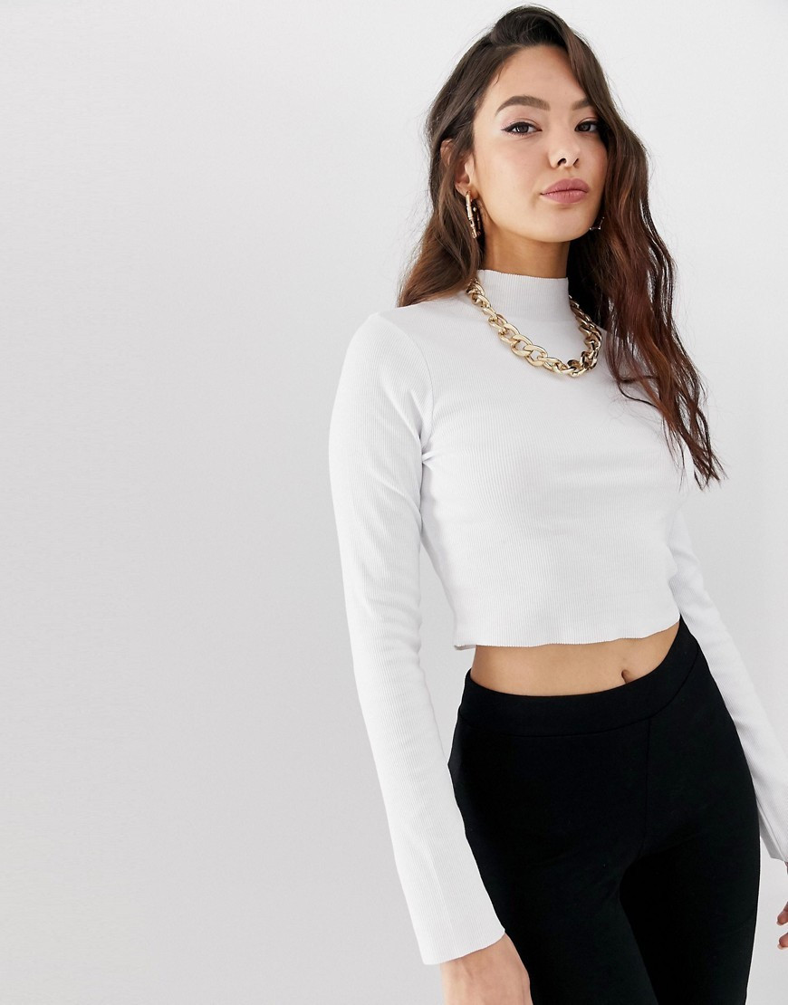 ASOS DESIGN long sleeve crop top with turtleneck and raw hem in rib in white | ASOS (Global)