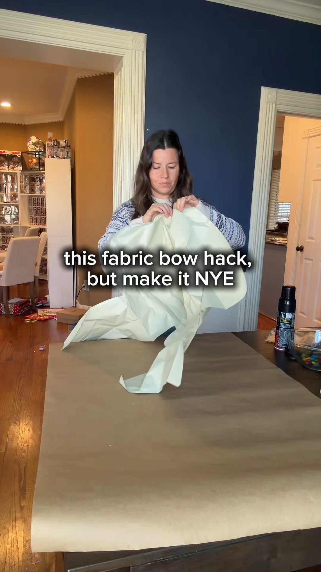 I tried the fabric bow balloon hack, but I used silver sequin fabric for the cutest New Year’s Eve decoration!

I’ll be honest, I was skeptical as I was doing this project, I was worried the fabric was not going to hold to the balloon once I inflated it but it worked and looks so cute! 🥰 

How to: 

🎀 Spray a giant bow shaped balloon with permanent spray adhesive.
🎀 Gently lay a large piece of fabric over the bow (I had my son help and it made it way easier to get the wrinkles smooth)
🎀 Flip it over and cut around the bow shape leaving about 1-2 inches of fabric around the edges.
🎀 Spray edges of balloon and fabric with spray adhesive and fold around the edges. 
🎀 I added a small strip of fabric to the back to use to hang it on the wall like a wreath. 
🎀 Inflate and enjoy!

Inspired by: @deannadunn

#DIYdecor #newyearseve #newyearsdecorations 

#LTKHoliday #LTKHome