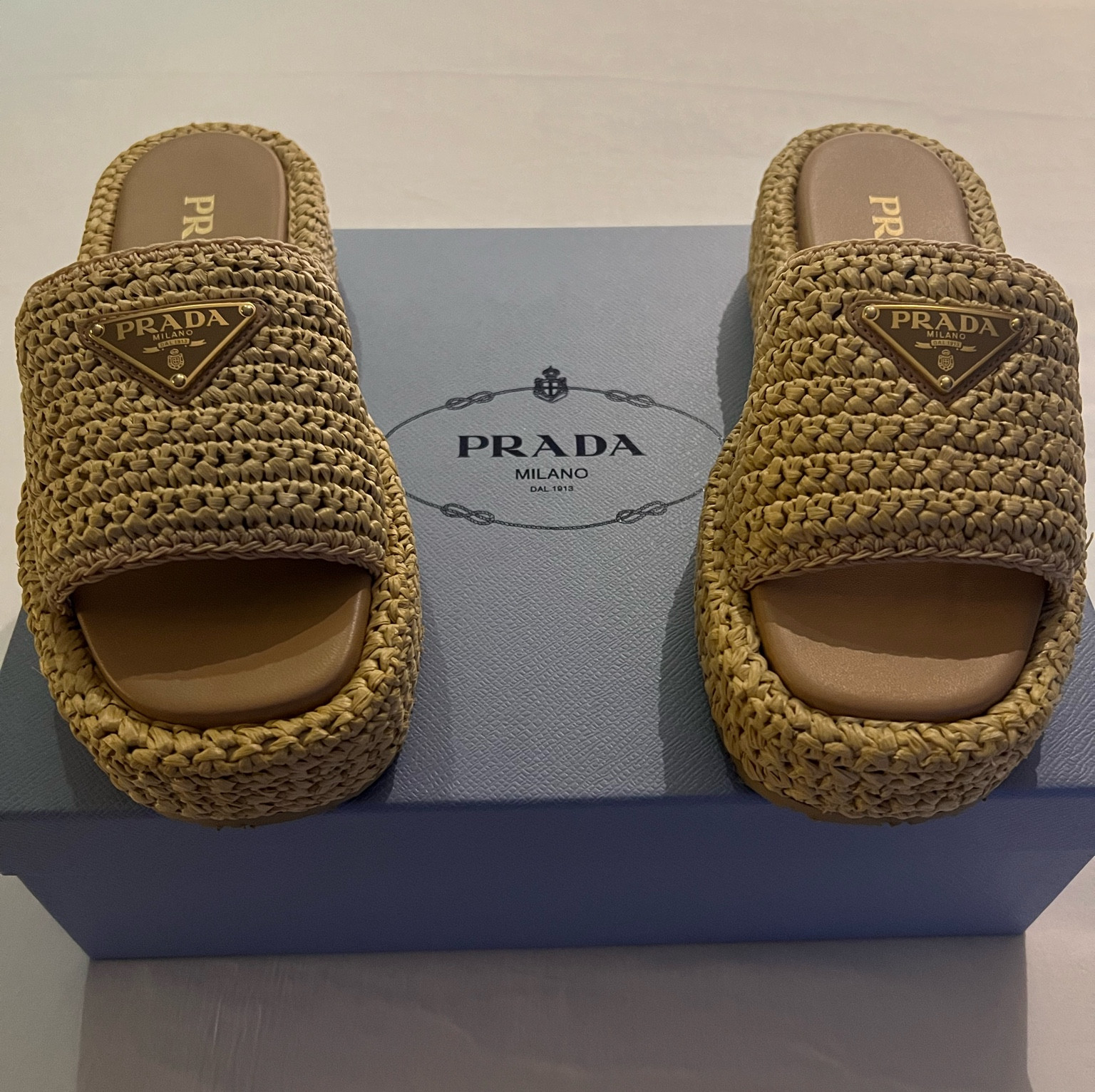I sized up half a size! Obsessed with these Prada sandals. Raffia sandal, vacation inspo, platform slides, Prada