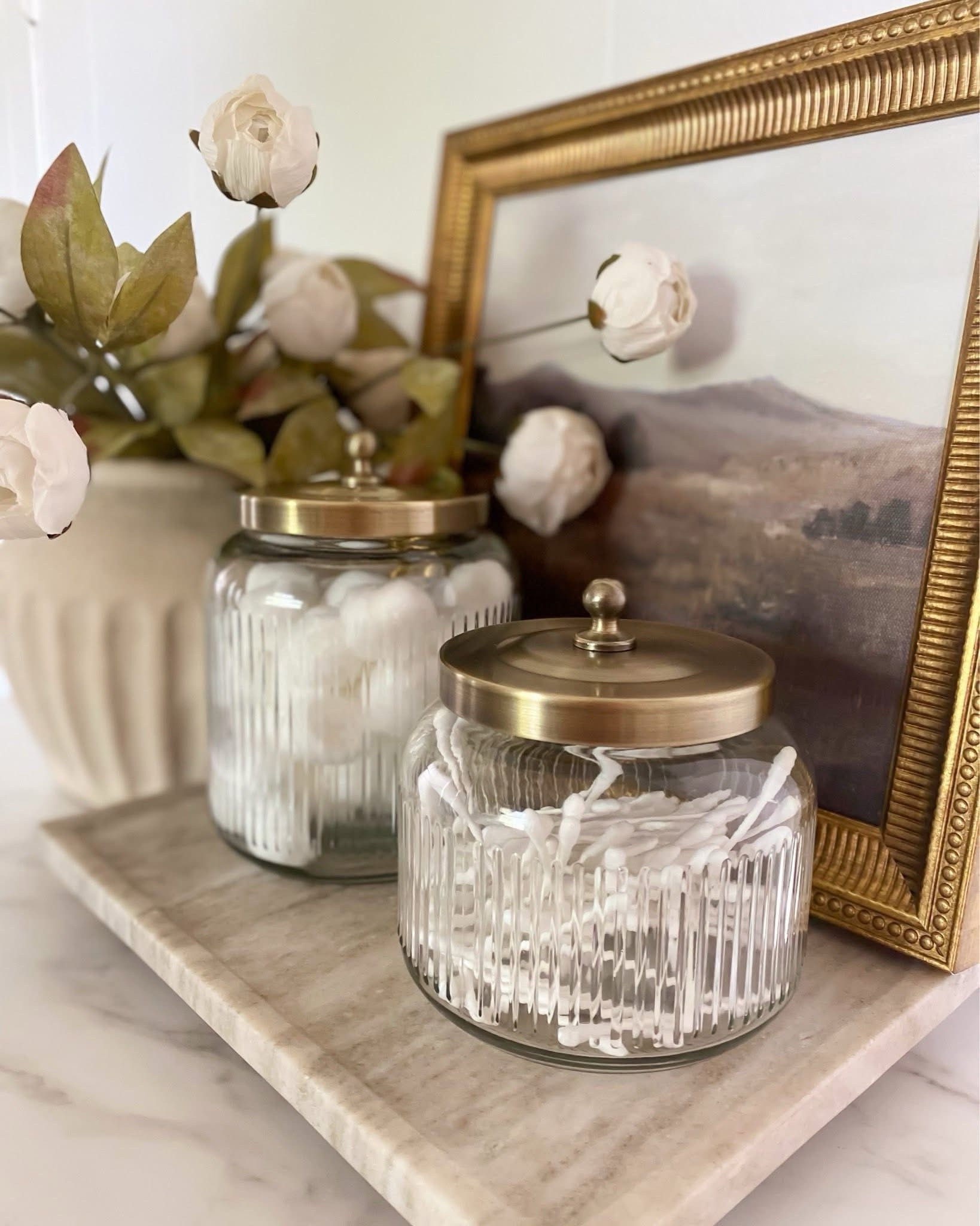 Spring Vase and stems combo ✨ Viral cream peonies, bathroom countertop styling idea, bathroom organizer idea, glass canister, terracotta vase, peony

#LTKSeasonal #LTKHome #LTKSaleAlert