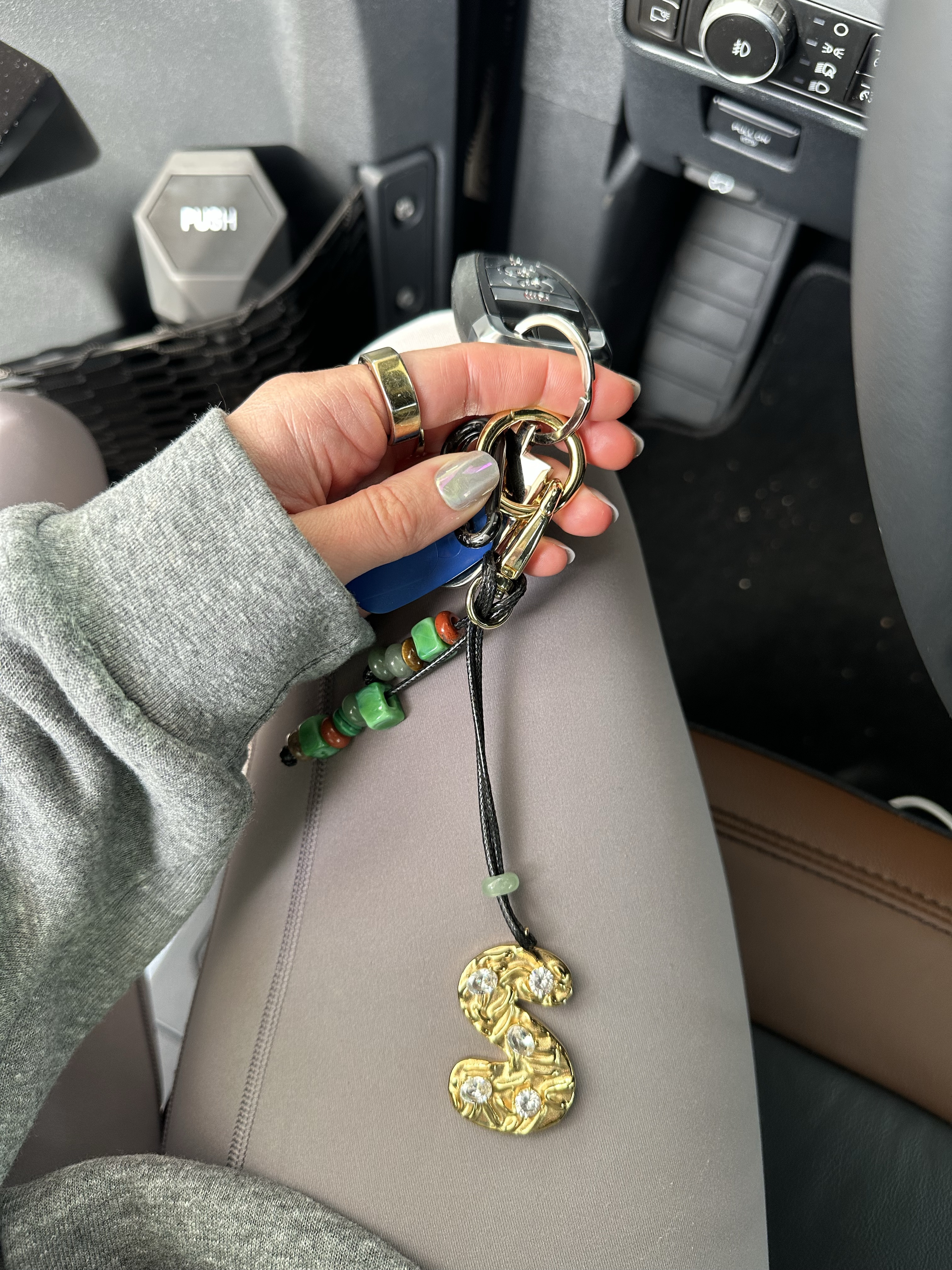 Hannah B Jewelry initial keychain. Elevate your everyday style with our Personalized Initial Bag Charm—a blend of elegance and individuality. Featuring a sleek initial charm adorned with sparkling crystals and complemented by artisan beads, this charm adds a touch of sophistication to any handbag, tote, or backpack.

Whether you’re treating yourself or gifting it to someone special, this charm is perfect for those who believe that every detail matters. Make it uniquely yours with an initial that represents you, your child, or a loved one. This is more than a bag charm; it’s a statement of style, character, and personal expression.

Perfect for the trendsetter who wants to carry a bit of personalized elegance wherever they go.

#LTKTravel #LTKFindsUnder100 #LTKItBag