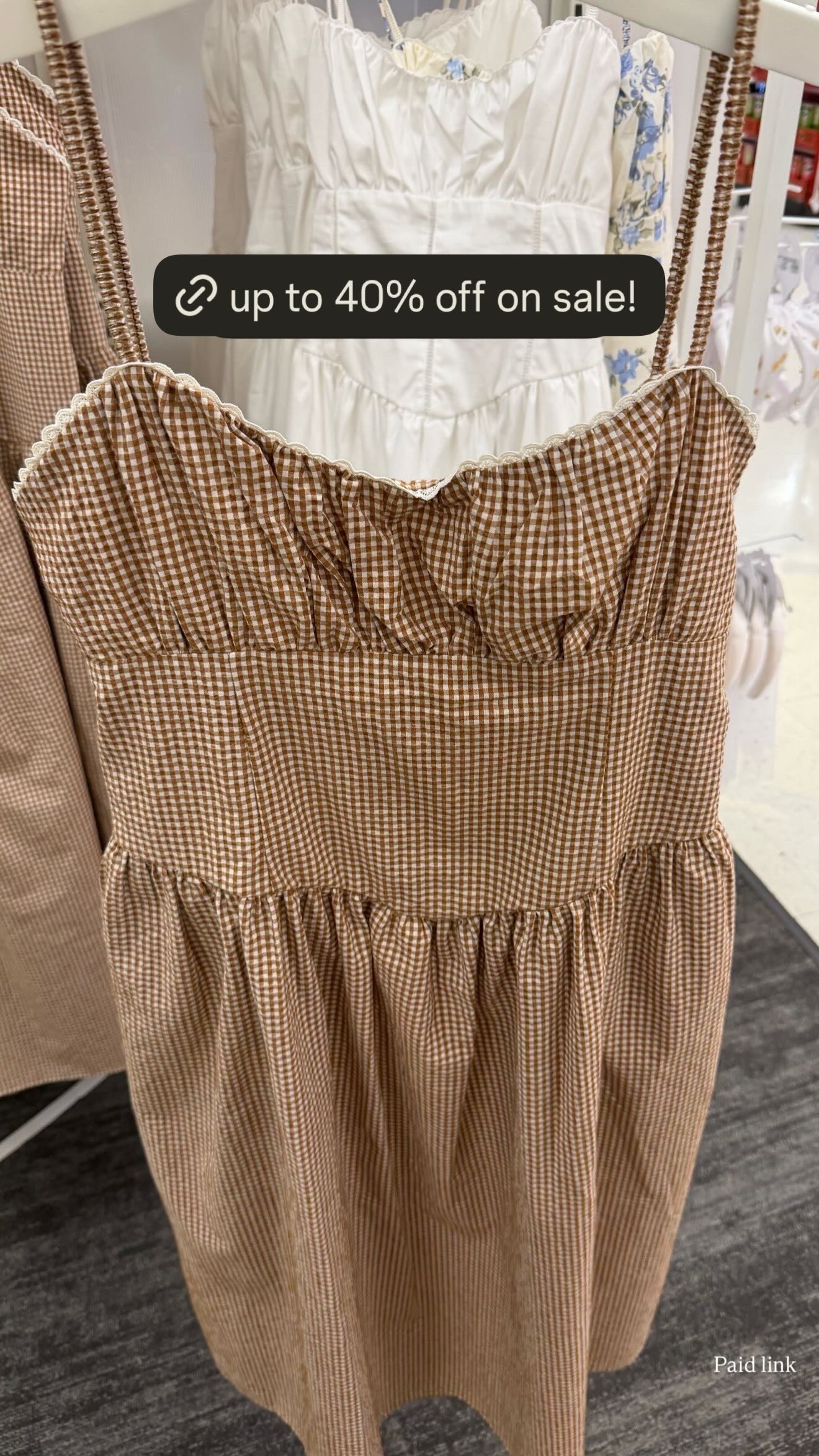 This brown gingham dress is so cute in person and on sale! It literally gives abercrombie vibes for way less. 
spring outfits 2026, easter dress women, easter outfits women, easter basket ideas, vacation outfits beach, spring dresses, date night outfits, plus size fashion, country concert outfits, work outfits, target finds, target deals, target circle, gingham dress, spring style 

 #LTKgrwm #LTKootd