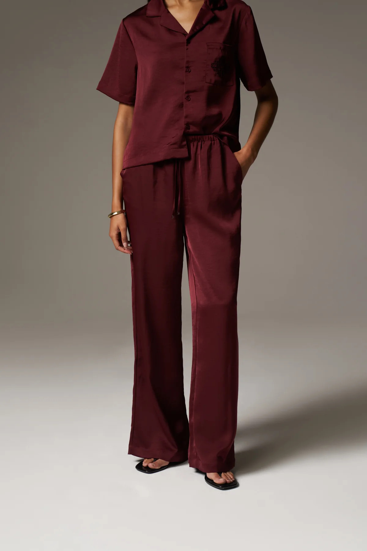 SATIN WIDE LEG EMBLEM TROUSERS - BURGUNDY | The Couture Club