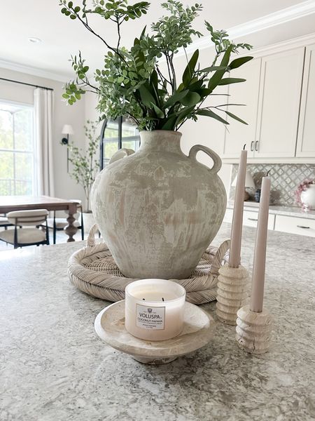I kinda have a thing for travertine. I got these taper holders on Amazon and I love them! 

Travertine candle holder, marble pedestal, CB2, vase, Maggie and Co. tray, wicker tray 

#LTKunder50 #LTKhome