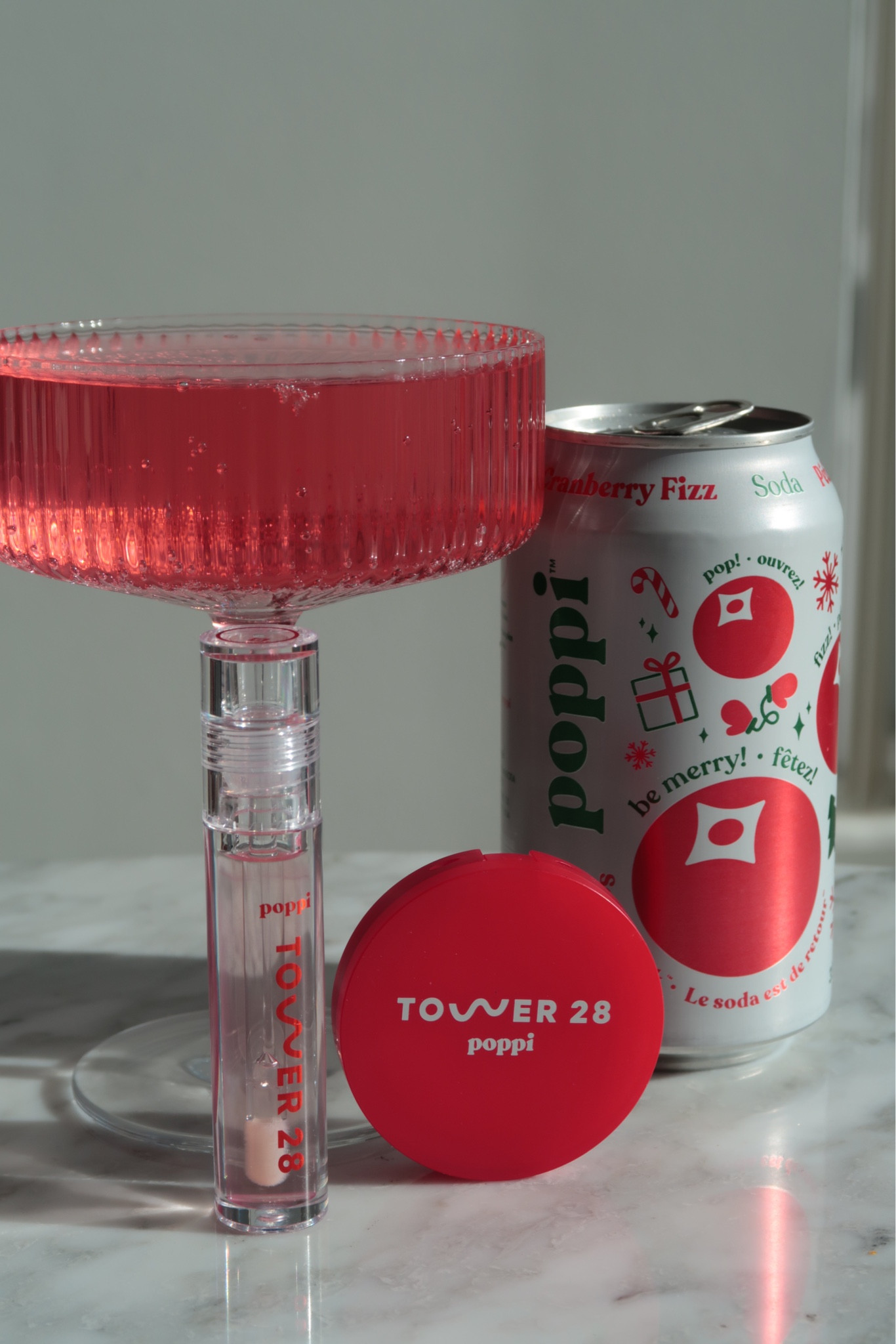 The Tower 28 × Poppi collab is such a fresh, playful take on clean beauty — a little fizzy, a little glowy, and completely effortless. The packaging feels bright and modern, with that soda-inspired pop of colour that makes it instantly fun to reach for. Inside, the formulas are classic Tower 28: lightweight, hydrating, and perfectly sheer, giving your lips a smooth, juicy finish without any stickiness.

Cranberry Fizz adds the prettiest wash of colour — soft, fresh, and naturally brightening. It’s that “healthy lip” look you get from a long walk or a cold soda, but bottled. The gloss feels cushiony and comfortable, and the tint blends seamlessly into the lips for that clean-girl glow you can wear every day.

It’s the kind of collab that just makes sense: Poppi’s playful fizz meets Tower 28’s effortless glow, creating a gloss that feels cheerful, wearable, and mood-boosting.

Hashtags
#Tower28Beauty #PoppiCollab #FizzFrost #CranberryFizz #CleanBeauty #JuicyLipLook #NoMakeupMakeup #GlowyMakeup #MinimalistBeauty #BeautyTok #GlossyLipLook #SoftGlow #AestheticBeauty

#LTKHoliday #LTKGiftGuide