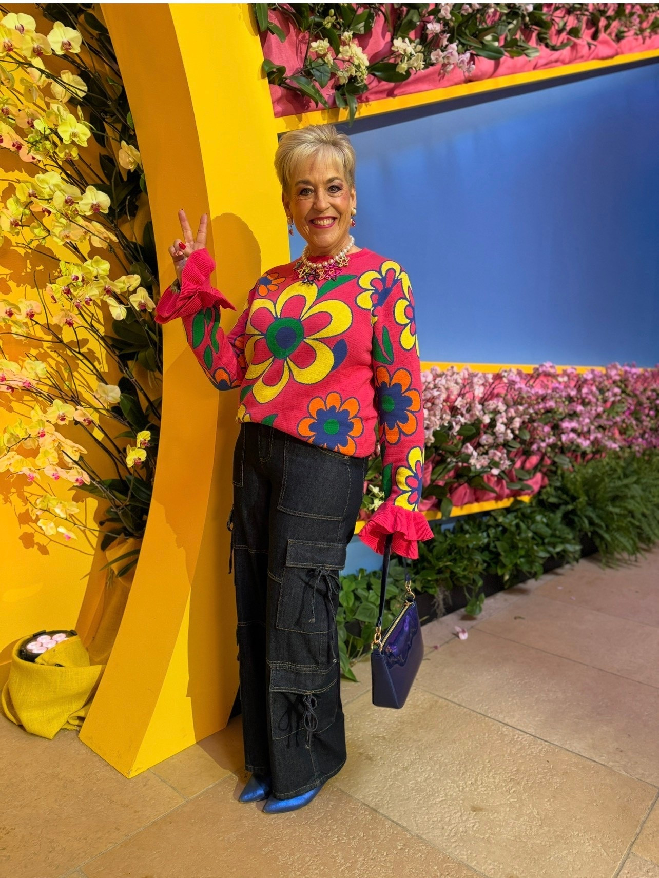 Flower Power Sweater Ruffled Wrists
Brightly Colored
70s Vibe
Metallic Boots
Metallic Purse