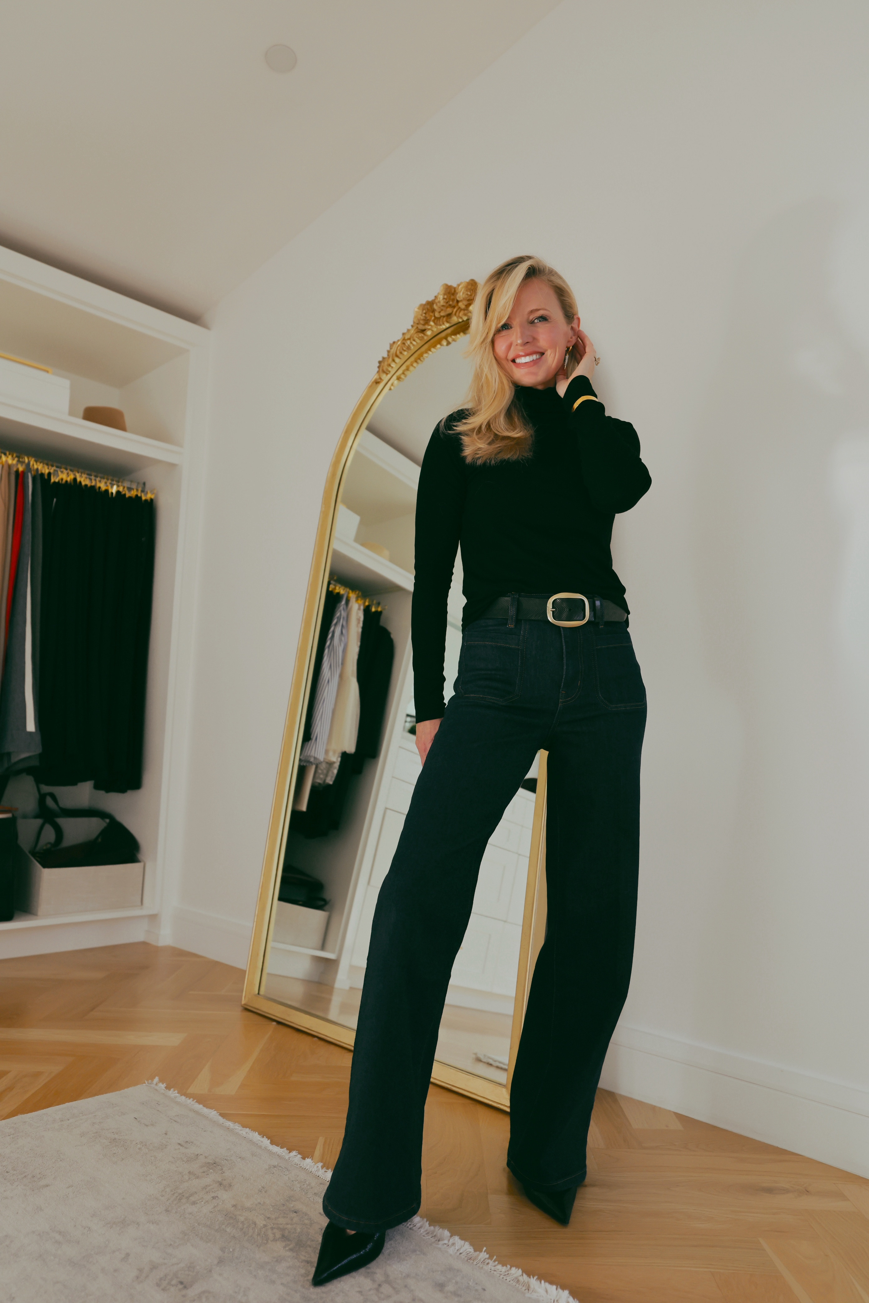 This is the outfit that makes you feel put together without trying!

FRAME patch pocket dark wash jeans, black turtleneck, wide leather belt with gold buckle, black pointed toe heels. Every element is simple; the combination is what makes it work. The belt does the proportioning, the turtleneck elongates the neck, the wide leg creates the long silhouette.

#LTKgrwm #LTKOver40 #LTKSaleAlert