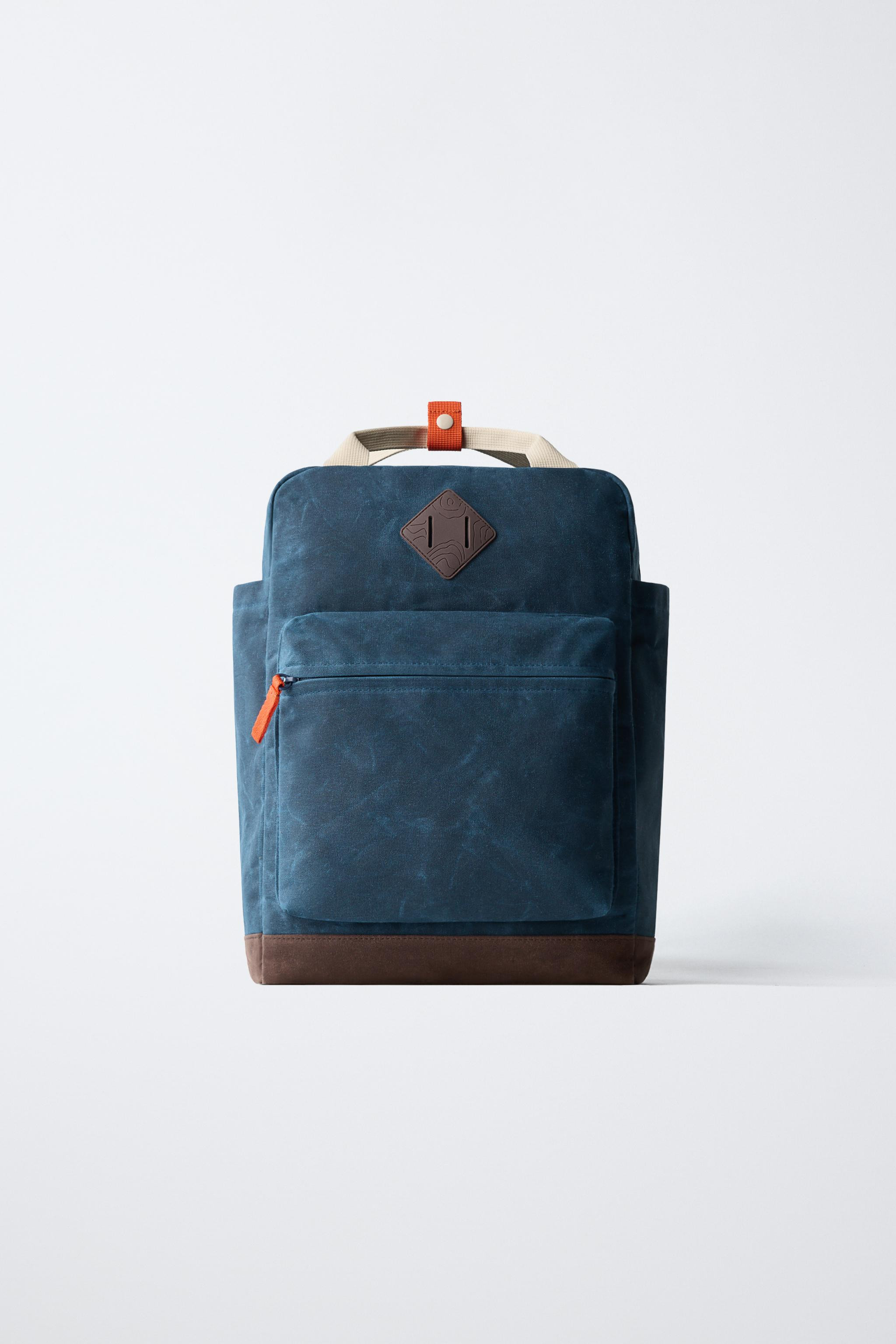 Backpack with front pockets and contrasting color details. Features a main compartment and front ... | Zara US