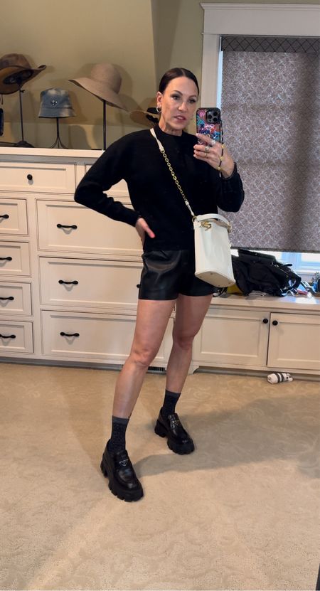 Can’t go wrong with a black on black situation. I love wearing shorts with a sweater and loafers with high socks. Sweater and bag are Dior. Wearing size small in sweater. Size small in shorts. Size 7.5 in boots. Everything runs TTS. 

#LTKstyletip #LTKbeauty #LTKshoecrush