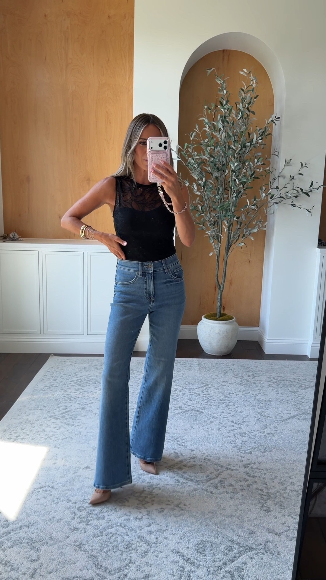 Date night outfit. This sheer lace bodysuit layers perfectly over a cami top. Love these flare jeans - wearing 0 short!

#LTKOver40 #LTKPetite #LTKSaleAlert