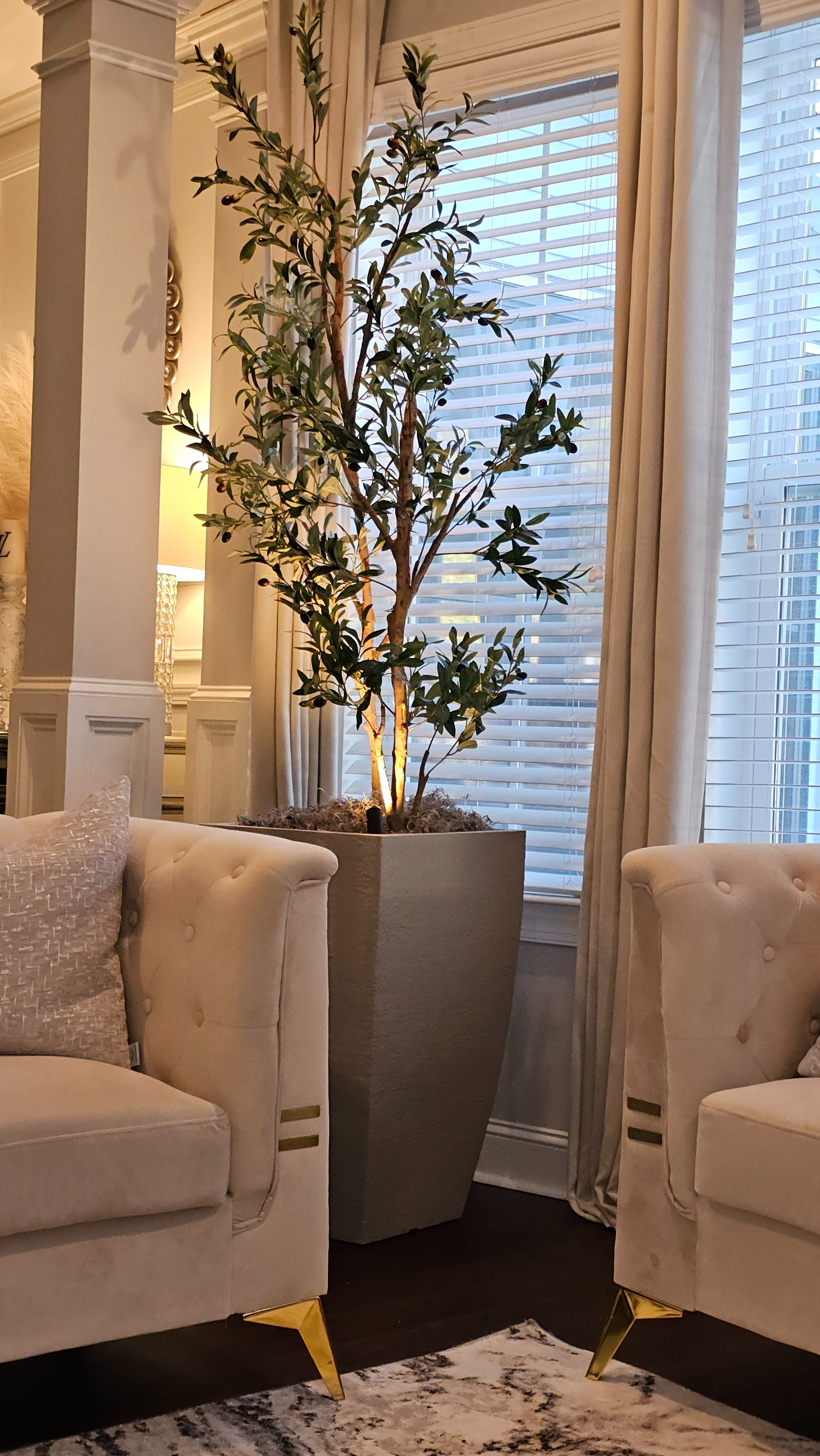 Faux olive tree in large planter in the corner of our living room really giving spring vibes. 

#LTKSeasonal #LTKhome #LTKfamily