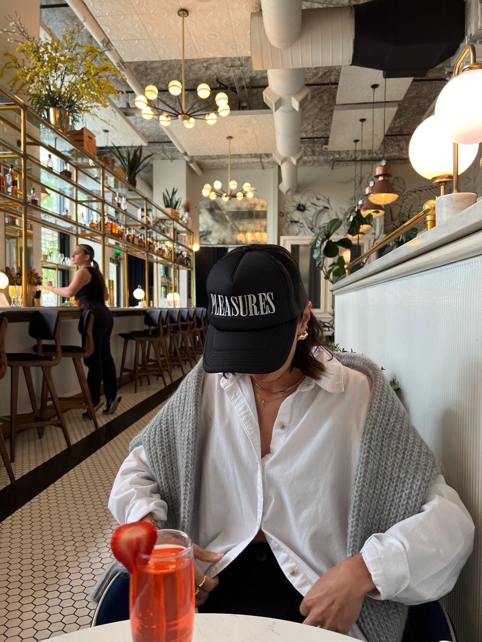 casual brunch outfit that is neutral and easy to recreate ft. black trousers, white button down, sezane knitwear sweater/cardigan in gray, black pleasures trucker hat and sneakers 

#LTKfindsunder100 #LTKstyletip #LTKworkwear