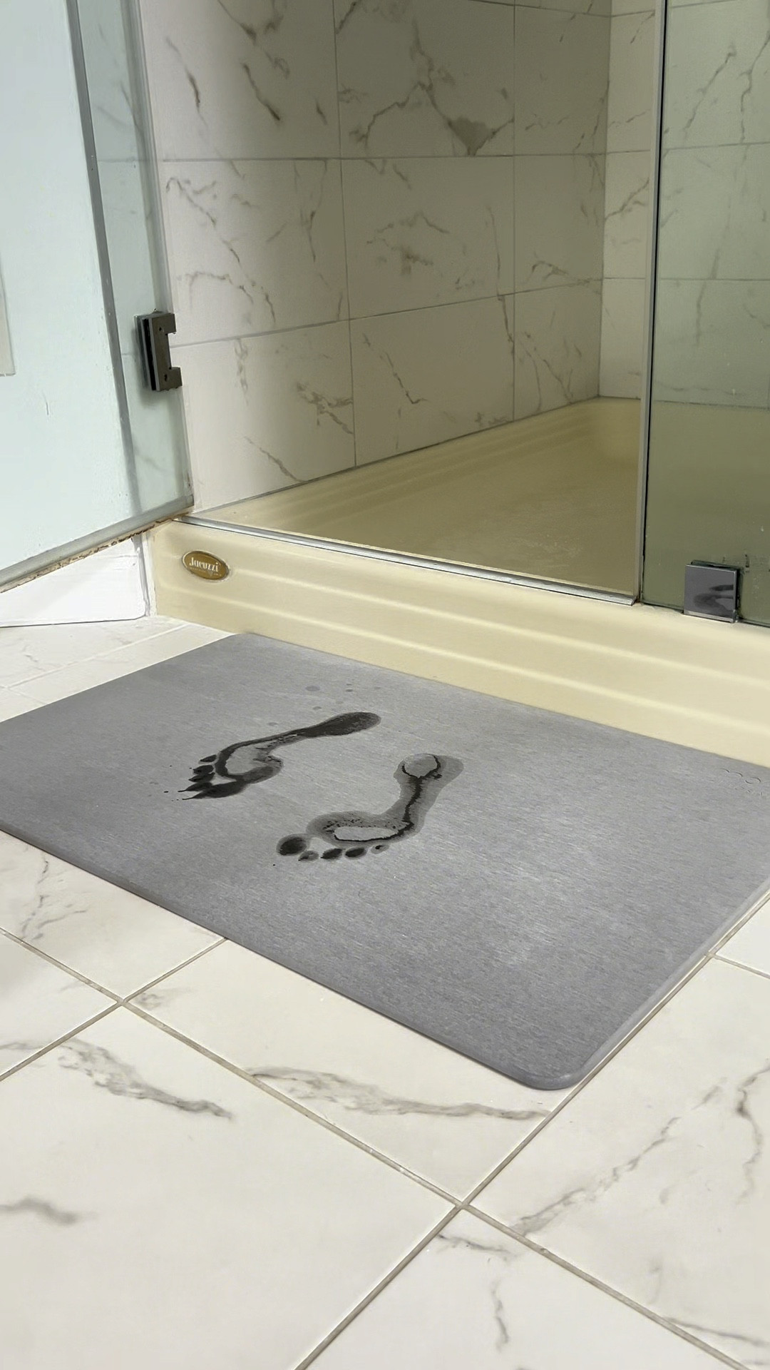 Living this Bathroom stone drying mat. Begins to dry instantly avoiding damp smelly mats. 

Available in two sizes and two tones of grey.

This one is the large light grey. 

#LTKHome #LTKVideo