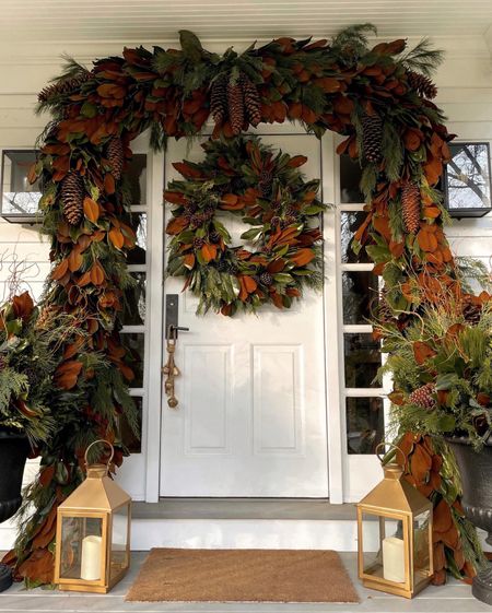 Kat Jamieson of With Love From Kat shares a front door garland. Holiday wreath, gold lanterns, bells, pine cones, Christmas, holiday decor.

#LTKHoliday #LTKhome #LTKSeasonal