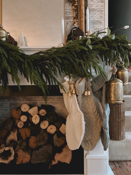 Christmas fireplace mantle decor | stockings | bells | garland