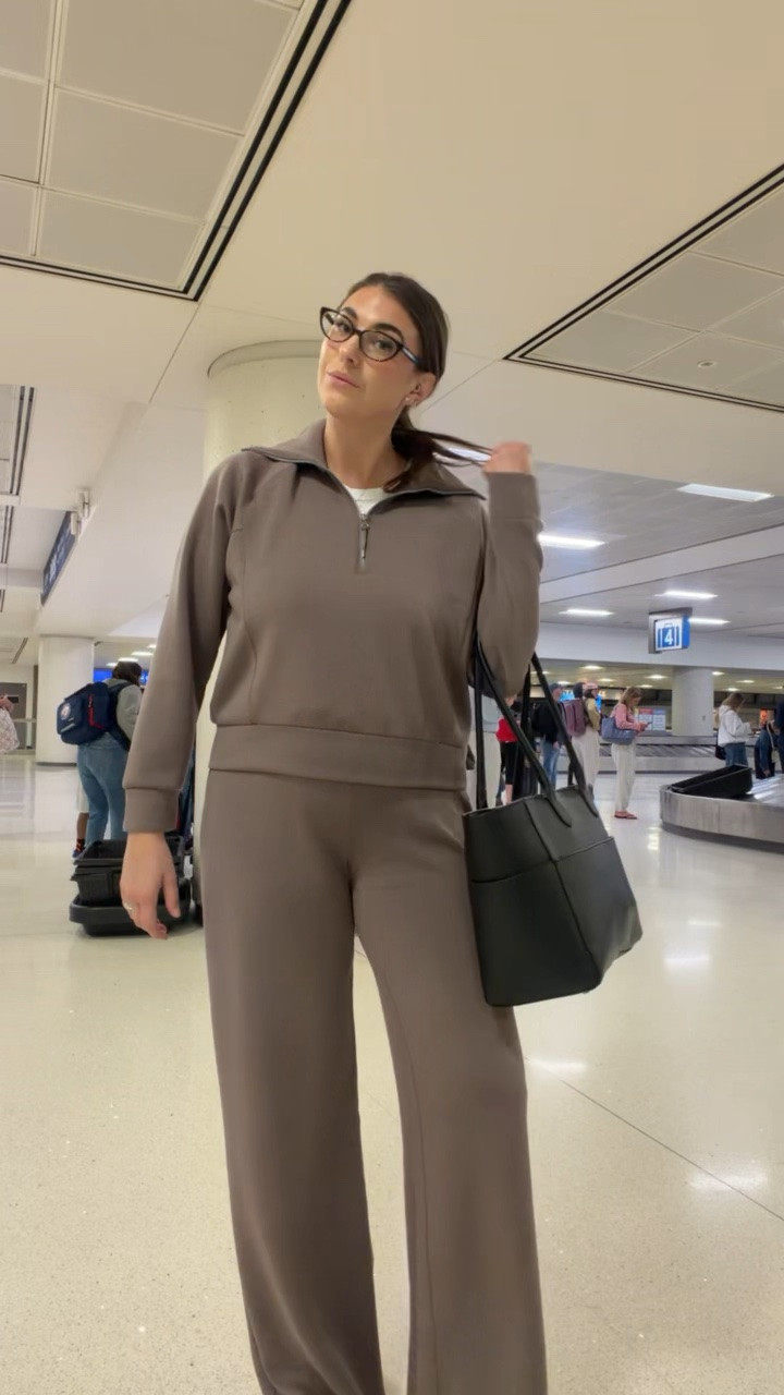 The kind of airport outfit that makes you look put together without sacrificing comfort 🤎 This matching set is SO good for travel days, errands, or just living in all fall long.

midsize travel outfit, size 12/14, matching lounge set, airport outfit, comfortable travel outfit, fall athleisure, wide leg pants, quarter zip set

#LTKTravel #LTKMidsize #LTKootd