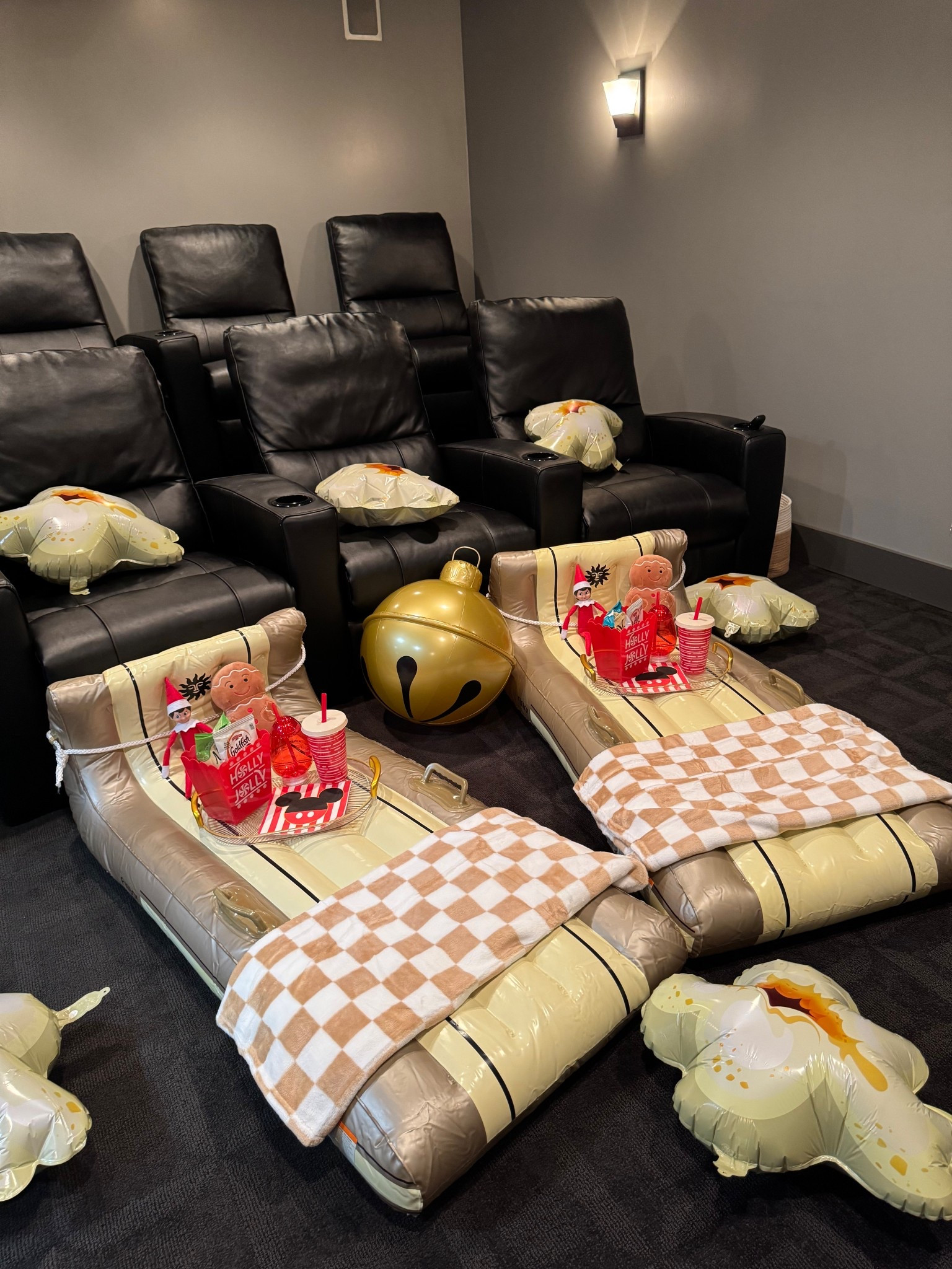 Movie night idea: sleds, popcorn balloons, inflatable jingle bell, snack trays and Christmas stuffies. 

Movie room. Family movie night. 

#LTKmomlife #LTKHoliday