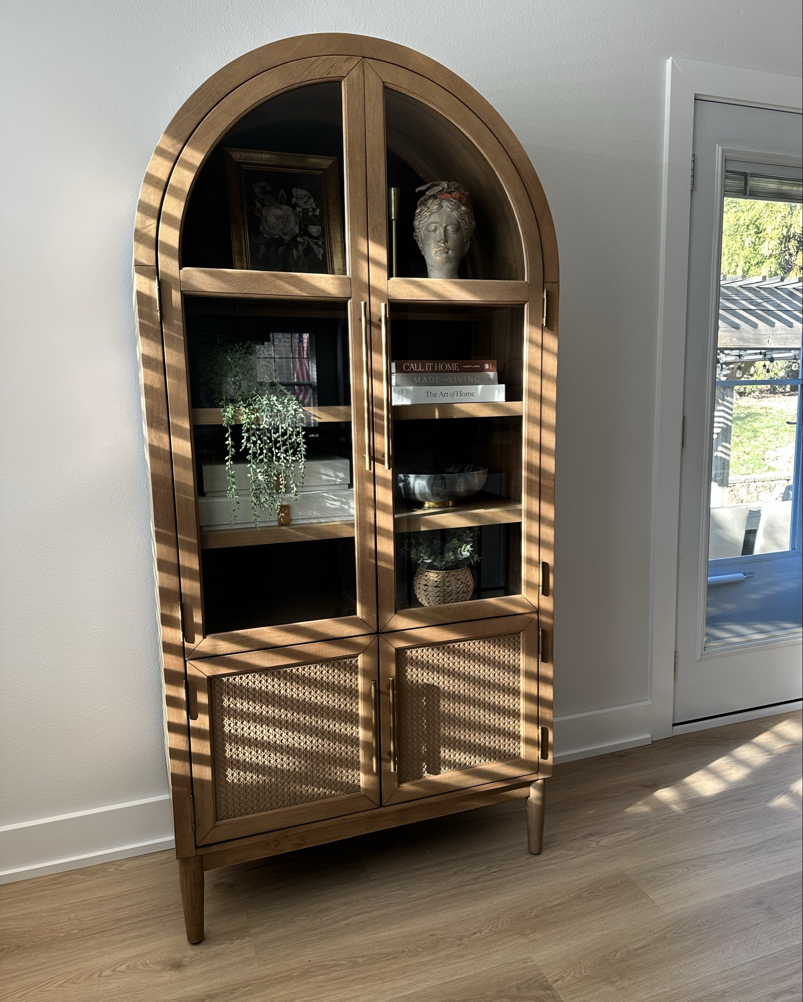 Sam’s Club viral Member's Mark Enzo Storage Cabinet With Rattan Cabinet Doors. Such good quality and finally almost finished styling it!! 

Target vintage floral framed wall canvas Threshhold 

Made for Living: Collected Interiors for All Sorts of Styles book 

The Art of Home: A Designer Guide to Creating an Elevated Yet Approachable Home book 

Decorative Photo Storage Boxes with Lids - Set of 2 Linen Organizers

The marble bowl and plants are TJ Maxx 

Arch cabinet, wood cabinet, shelf styling, shelf decor



#LTKHome #LTKFindsUnder50 #LTKStyleTip