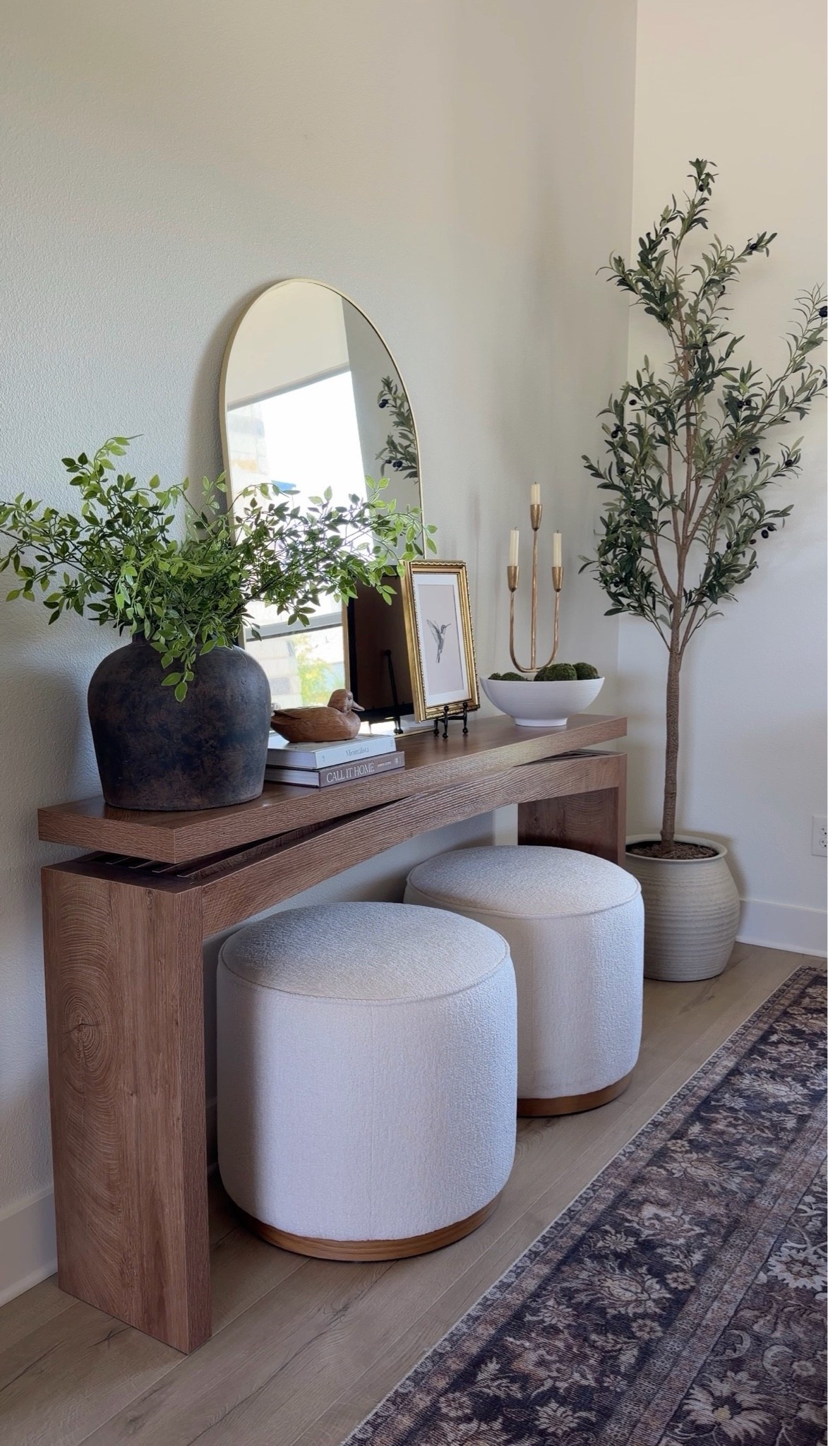 Designer-inspired entryway moment ✨

This beautiful console table is the perfect foundation for creating that elevated, collected look. Adding in a few styling must-haves like layered lighting, greenery, books, candles, and textured decor instantly makes the space feel warm, polished, and welcoming 🤍

Home decor, pottery barn inspired, home Inspo, console table, candelabra, greenery, stems, rustic vase, ottomans, olive tree, arch mirror

#LTKSaleAlert #LTKHome #LTKSeasonal