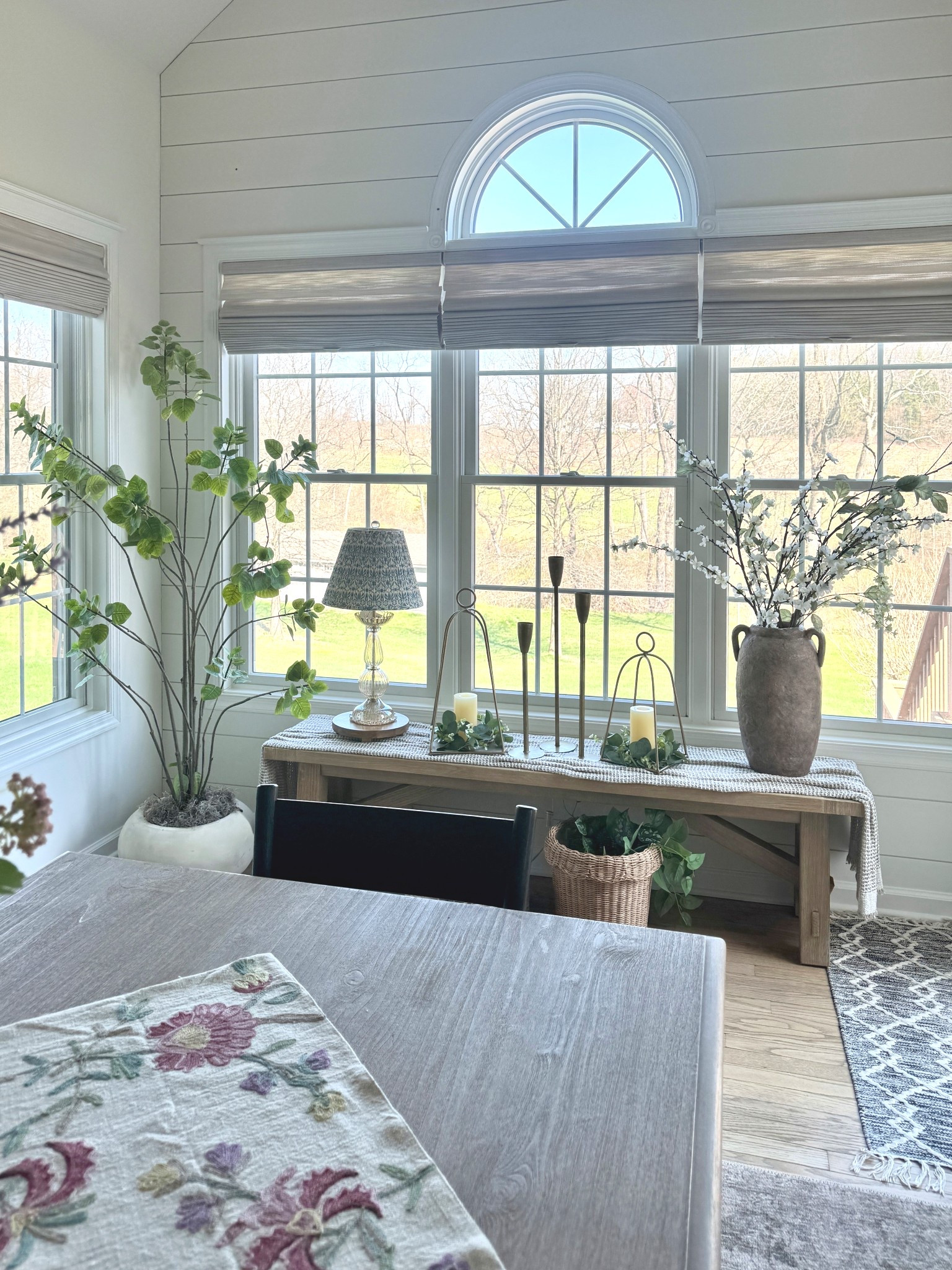 My favorite whimsical 6' coggygria tree. Planters, greenery, florals, similar candlesticks and open lanterns, table throw, vases