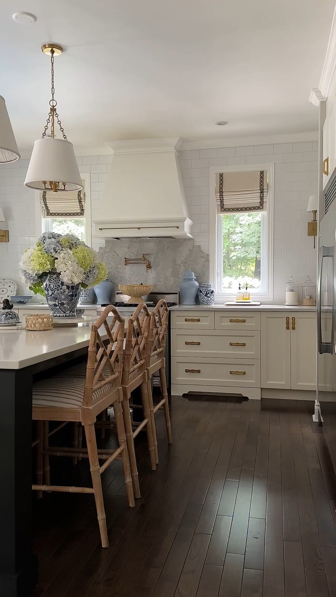 Chic, classic kitchen styling 
Blue and white accents, chippendale bar stools, ginger jars, faux flowers, brass hardware, traditional lighting

#LTKSeasonal #LTKHome