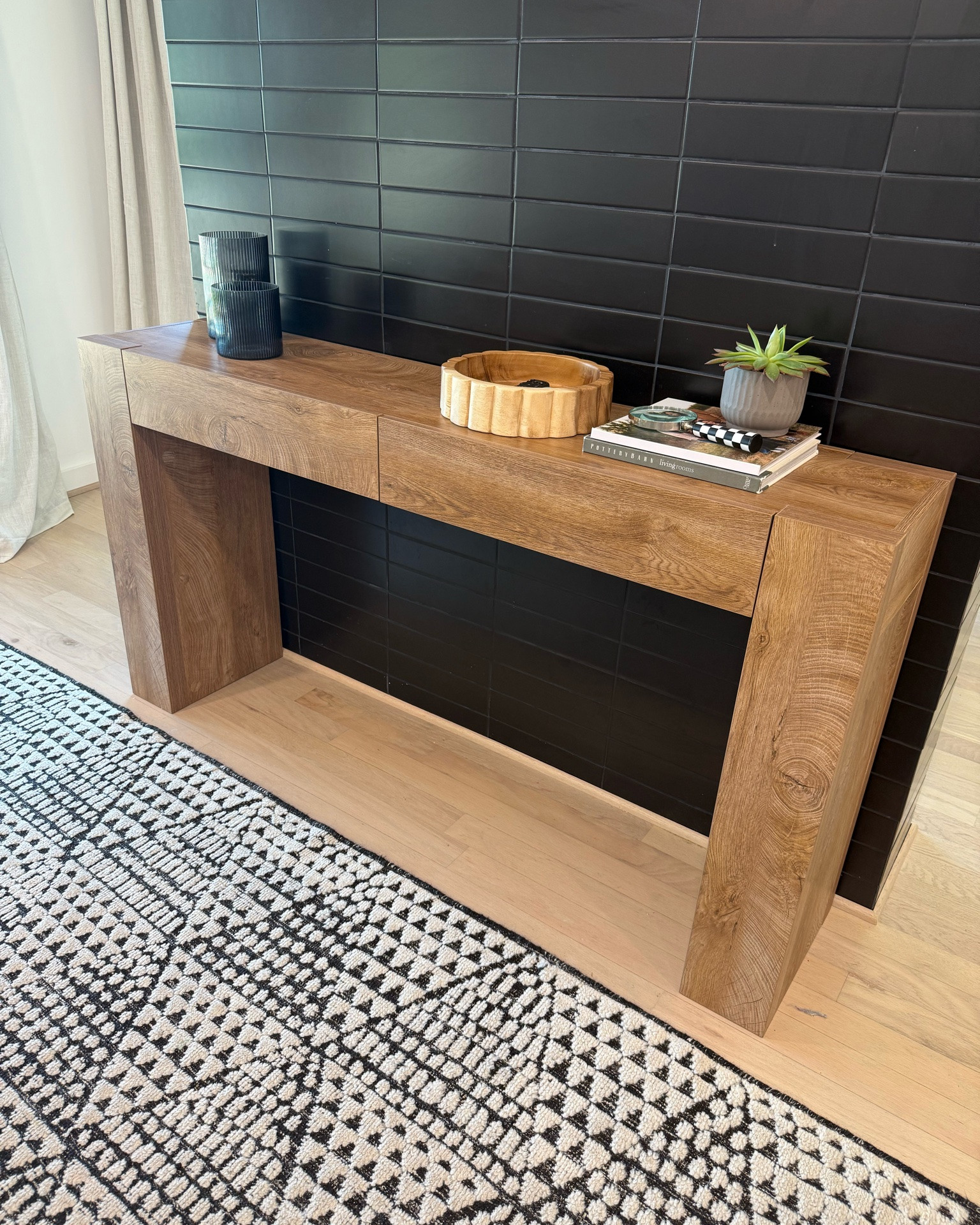 New console table on our tv wall! Still trying to pick some foot stools or bench to go under! Not the best drawers, but I do love the overall look 🤎🖤

#LTKHome