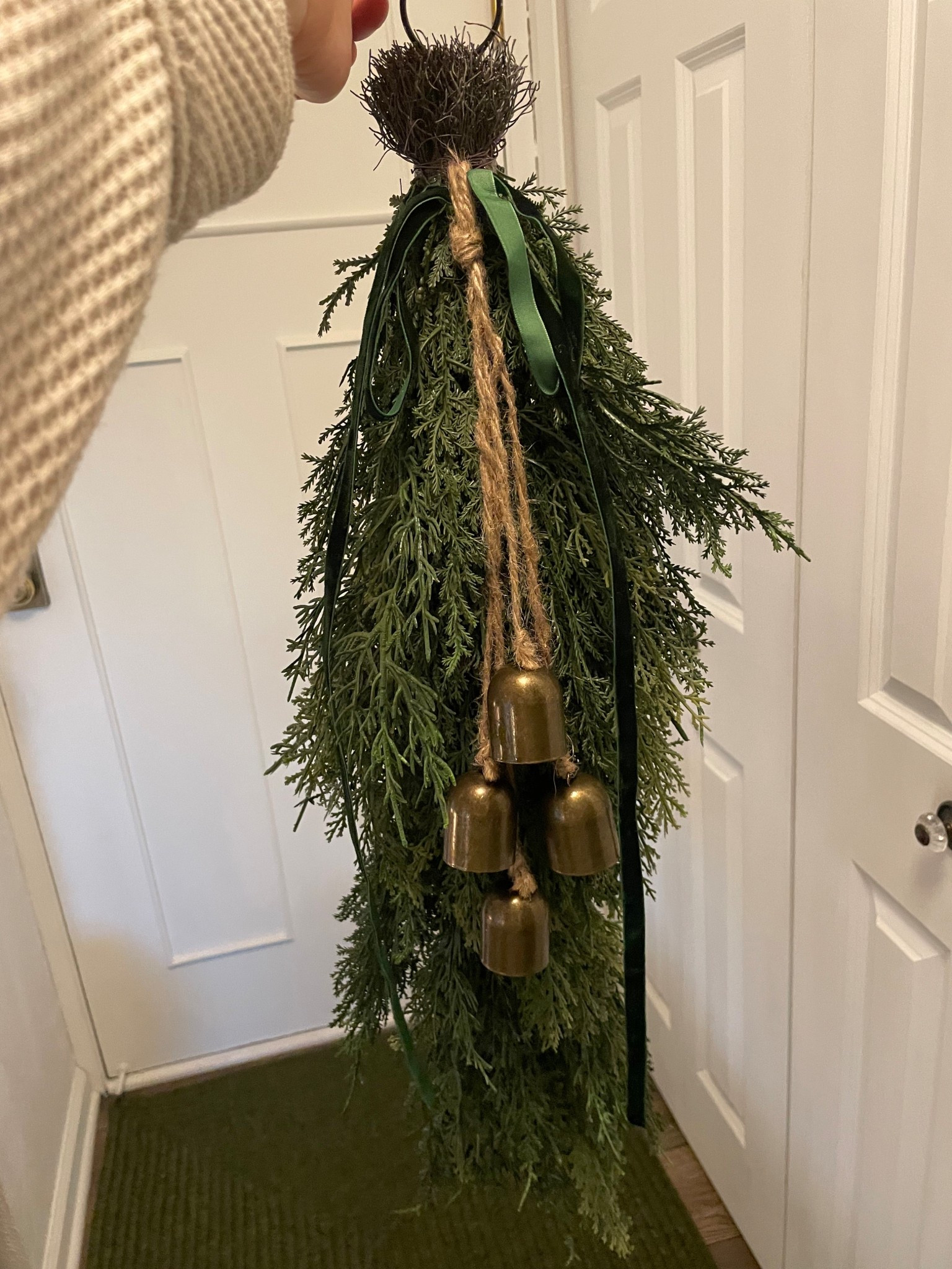 I opted for a Christmas swag for my door this year instead of a wreath. It’s already complete with ribbon and bells…just hang and voila!

#LTKHoliday #LTKFindsUnder50 #LTKHome