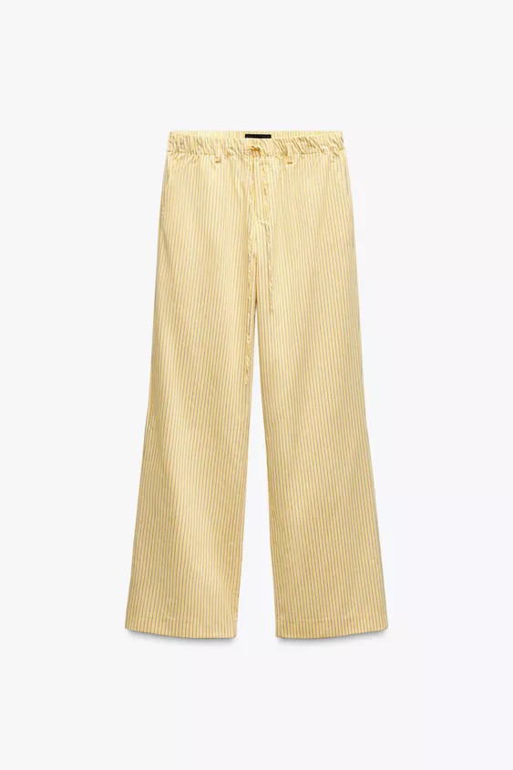 Mid-waist trousers with an elasticated waistband and adjustable drawstrings. Side pockets. Straig... | Zara US