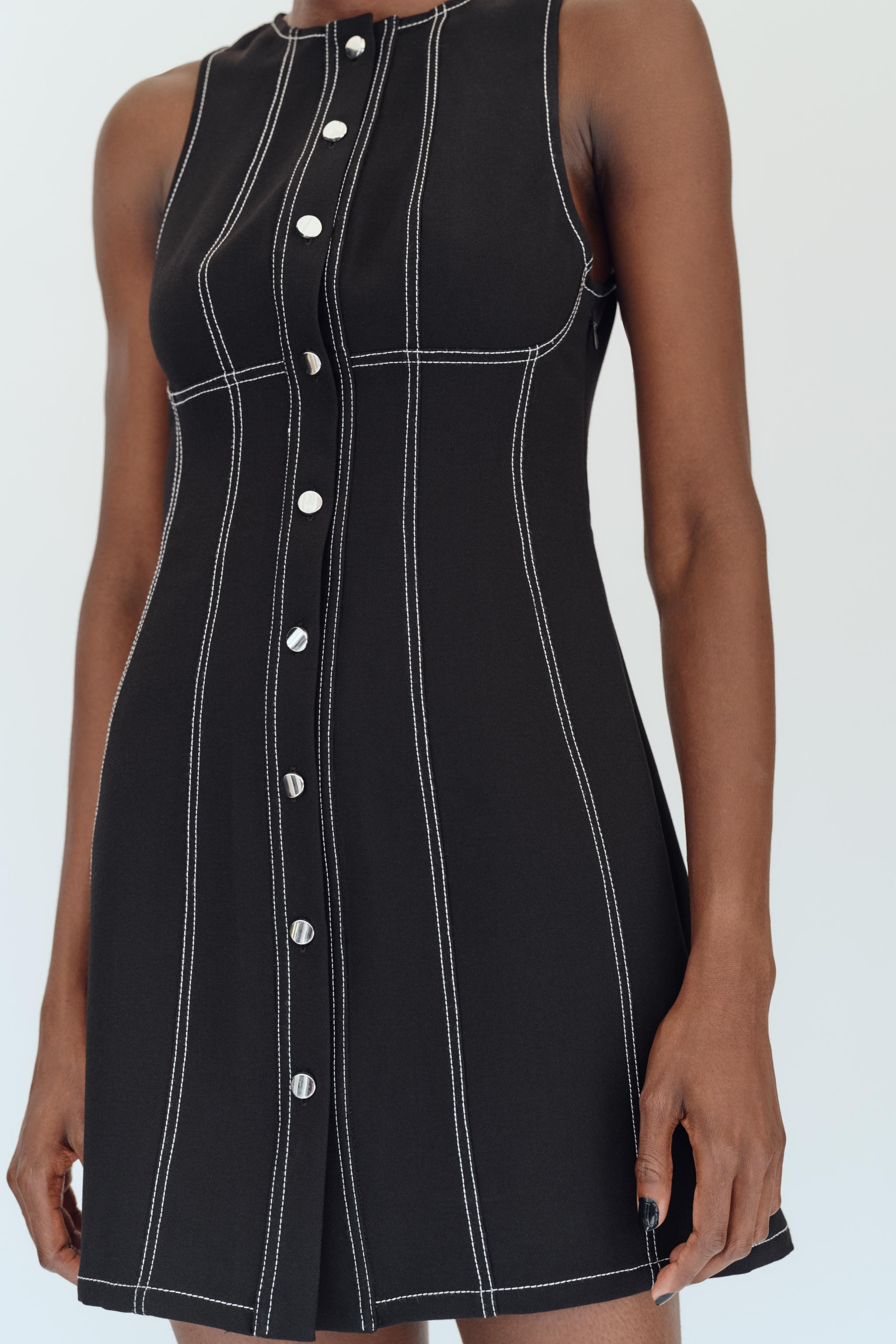 Mini dress with a round neckline and sleeveless design. Featuring faux button detail at the front... | Zara UK