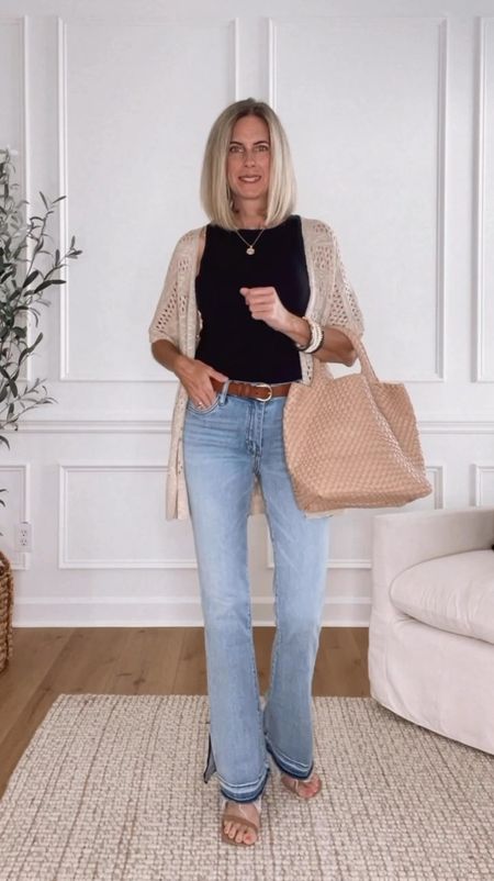 ⭐️ These flare jeans are so good! I love the side slits and the frayed hem. Wearing a 2. Eyelet crochet cardigan is so pretty and comes in other colors. Wearing a small in the top and cardigan. Perfect date night outfit or girls night out! 

#LTKFindsUnder100 #LTKStyleTip #LTKOver40