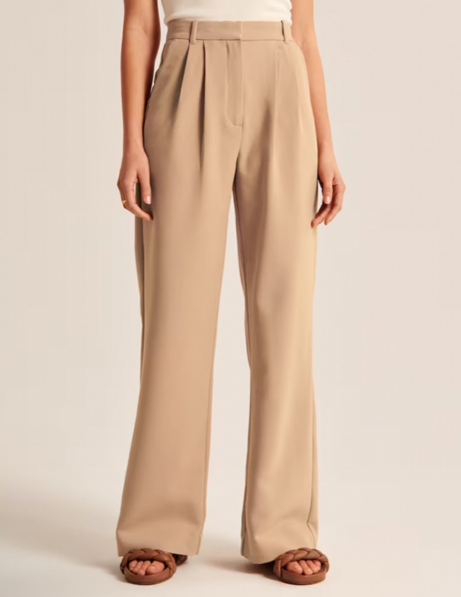 The signature A&F Sloane Tailored Pant in an everyday menswear fabric, that's perfect for dressing up or down. The Sloane Tailored Pant is an ultra-high rise tailored wide leg pant with figure-flattering pleating details, a functional fly and pockets and a partially elasticated waistband for ultimate adjustability. 

#LTKworkwear #LTKSeasonal #LTKunder100