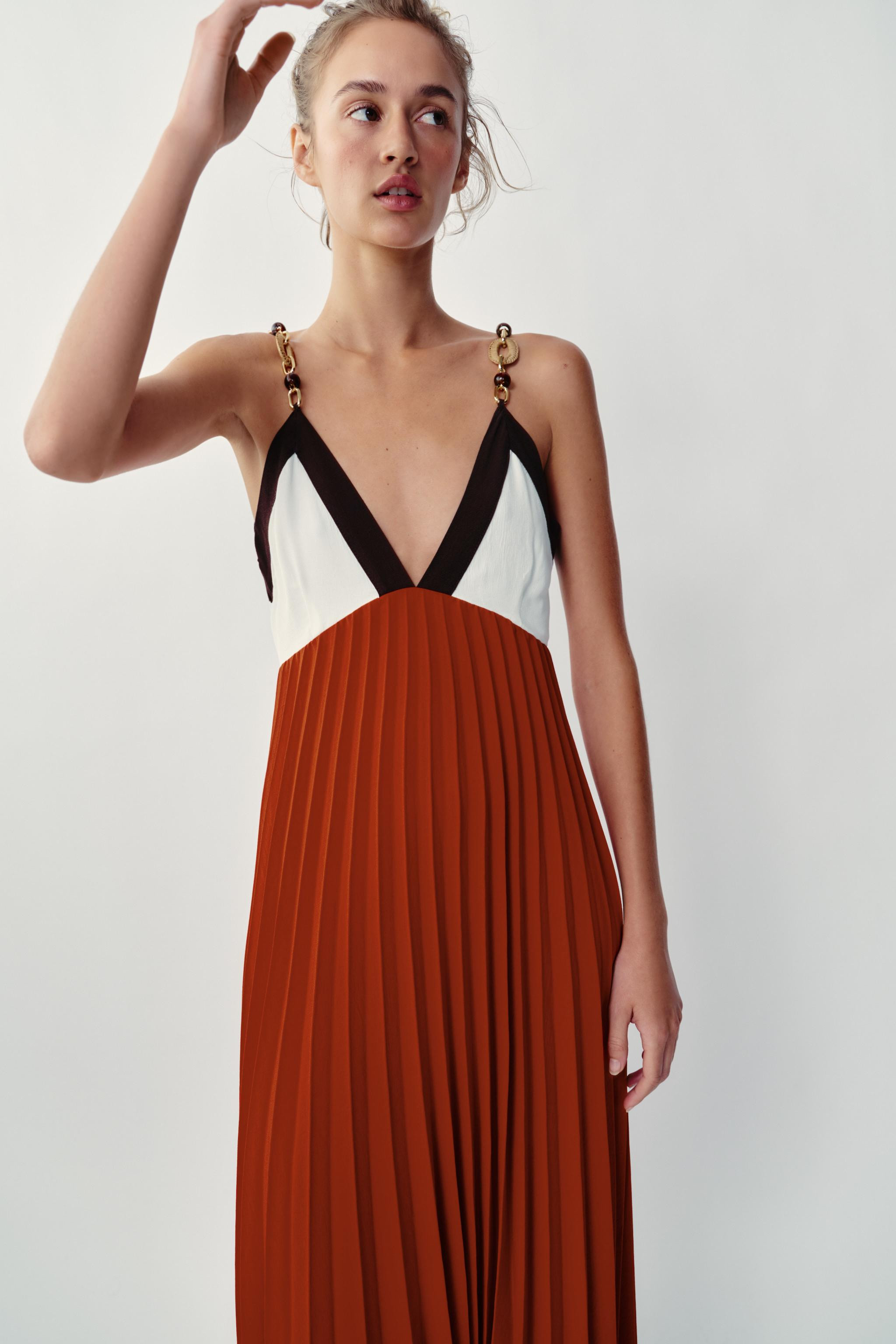 Model height: 173 cmV-neck dress with thin straps and bead embellishments. Concealed side zip fas... | Zara UK
